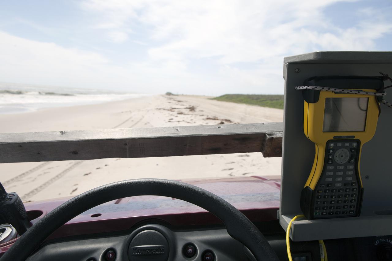 CAPE CANAVERAL, Fla. -- At the Kennedy Space Center in Florida, University of Florida geologists and NASA biologists use an all-terrain vehicle to survey sand dunes that have been restored along a 1.2 mile stretch of shoreline near Launch Pads 39A and B. As part of a six-month effort to help prevent further erosion, 180,000 shrubs, including grasses, sunflowers, vines, sea grapes and palmettos were planted.      Constant pounding from tropical storms, such as Hurricane Sandy in October of 2012, other weather systems and higher than usual tides, destroyed sand dunes protecting infrastructure at the spaceport. Photo credit: NASA/Dan Casper