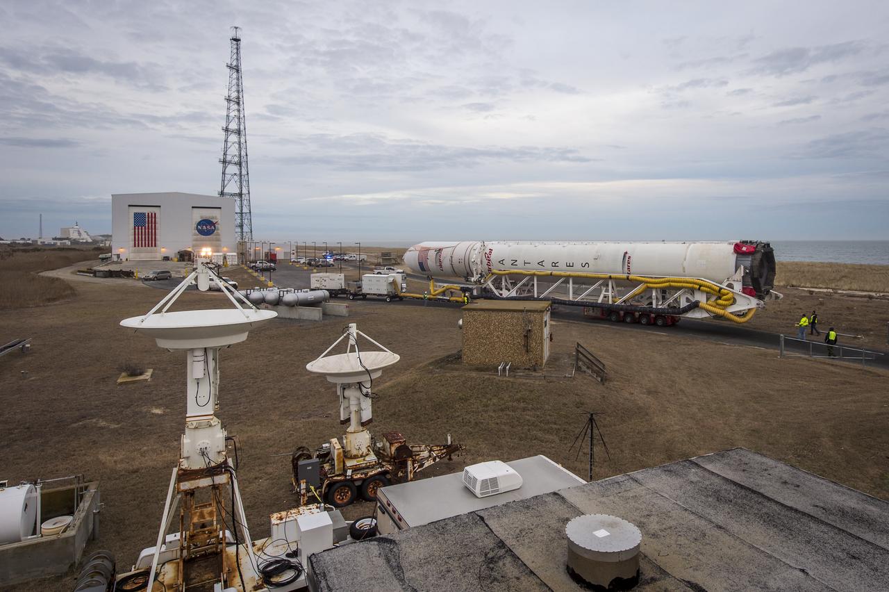 An Orbital Sciences Corporation Antares rocket is seen as it is rolled out to launch Pad-0A at NASA's Wallops Flight Facility, Sunday, January 5, 2014 in advance of a planned Wednesday, Jan. 8th, 1:32 p.m. EST launch, Wallops Island, VA. The Antares will launch a Cygnus spacecraft on a cargo resupply mission to the International Space Station. The Orbital-1 mission is Orbital Sciences' first contracted cargo delivery flight to the space station for NASA. Among the cargo aboard Cygnus set to launch to the space station are science experiments, crew provisions, spare parts and other hardware. Photo Credit: (NASA/Bill Ingalls)