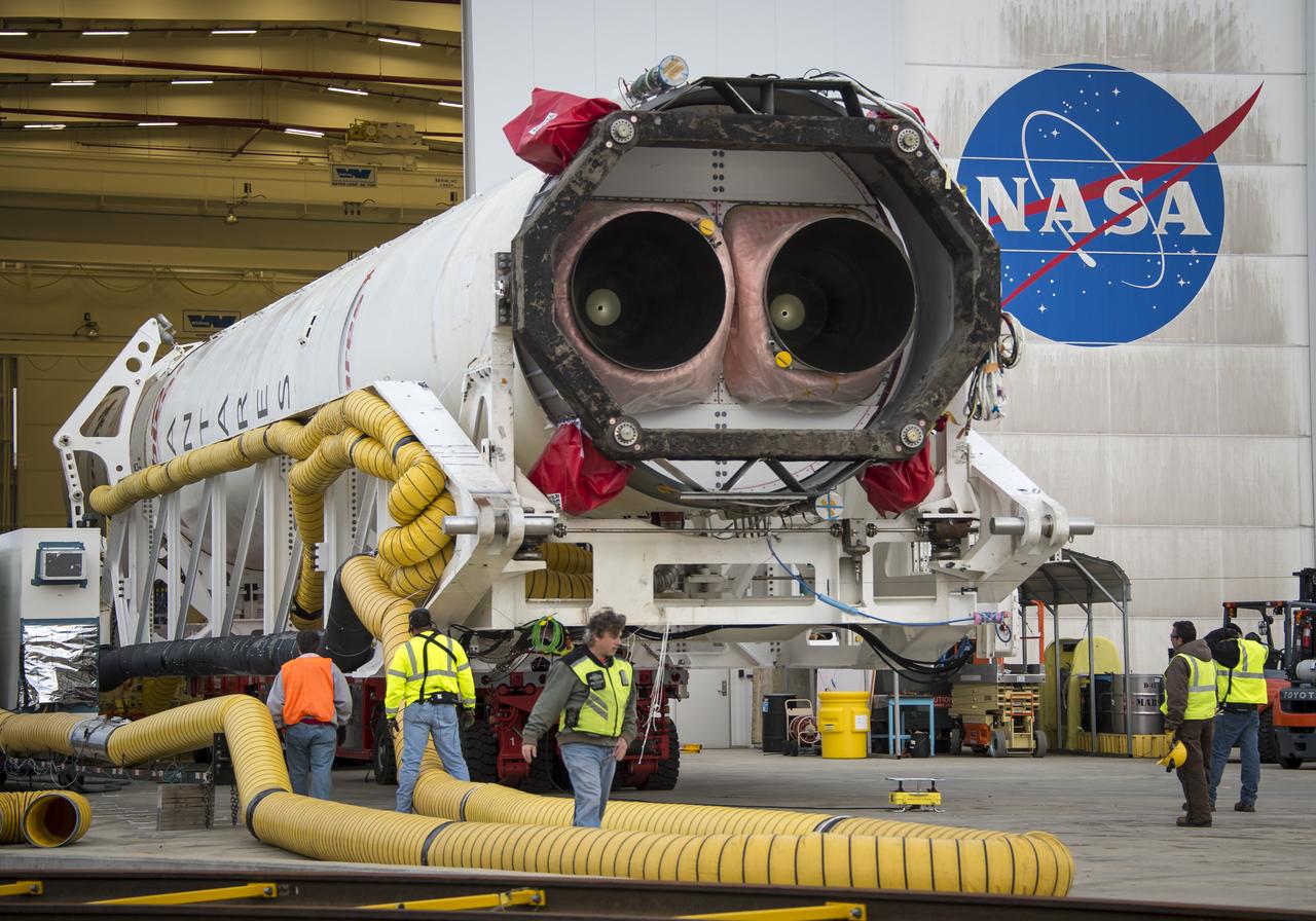 An Orbital Sciences Corporation Antares rocket is seen as it is rolled out to launch Pad-0A at NASA's Wallops Flight Facility, Sunday, January 5, 2014 in advance of a planned Wednesday, Jan. 8th, 1:32 p.m. EST launch, Wallops Island, VA. The Antares will launch a Cygnus spacecraft on a cargo resupply mission to the International Space Station. The Orbital-1 mission is Orbital Sciences' first contracted cargo delivery flight to the space station for NASA. Among the cargo aboard Cygnus set to launch to the space station are science experiments, crew provisions, spare parts and other hardware. Photo Credit: (NASA/Bill Ingalls)