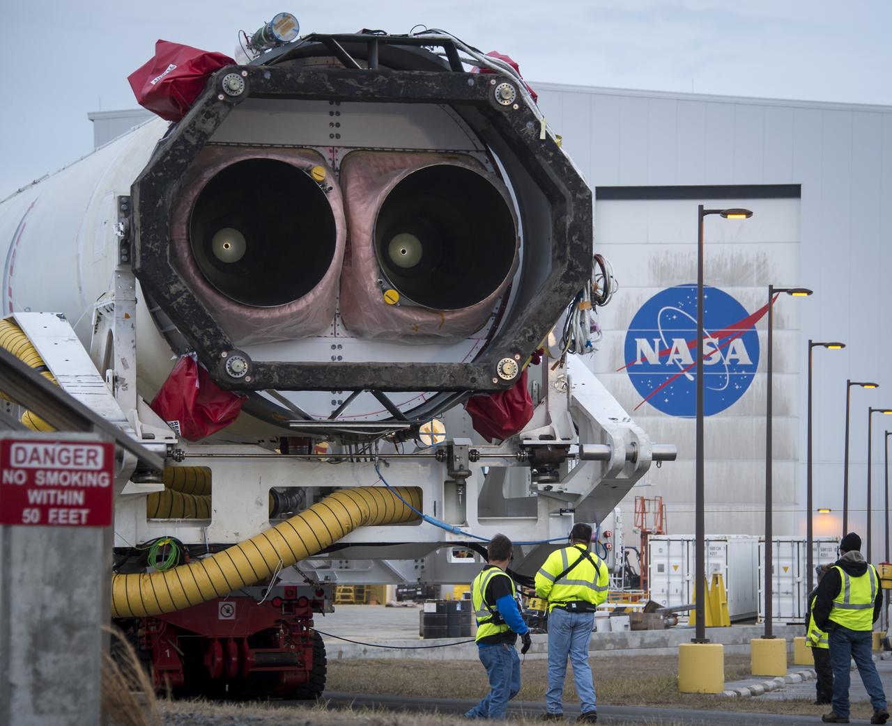 An Orbital Sciences Corporation Antares rocket is seen as it is rolled out to launch Pad-0A at NASA's Wallops Flight Facility, Sunday, January 5, 2014 in advance of a planned Wednesday, Jan. 8th, 1:32 p.m. EST launch, Wallops Island, VA. The Antares will launch a Cygnus spacecraft on a cargo resupply mission to the International Space Station. The Orbital-1 mission is Orbital Sciences' first contracted cargo delivery flight to the space station for NASA. Among the cargo aboard Cygnus set to launch to the space station are science experiments, crew provisions, spare parts and other hardware. Photo Credit: (NASA/Bill Ingalls)
