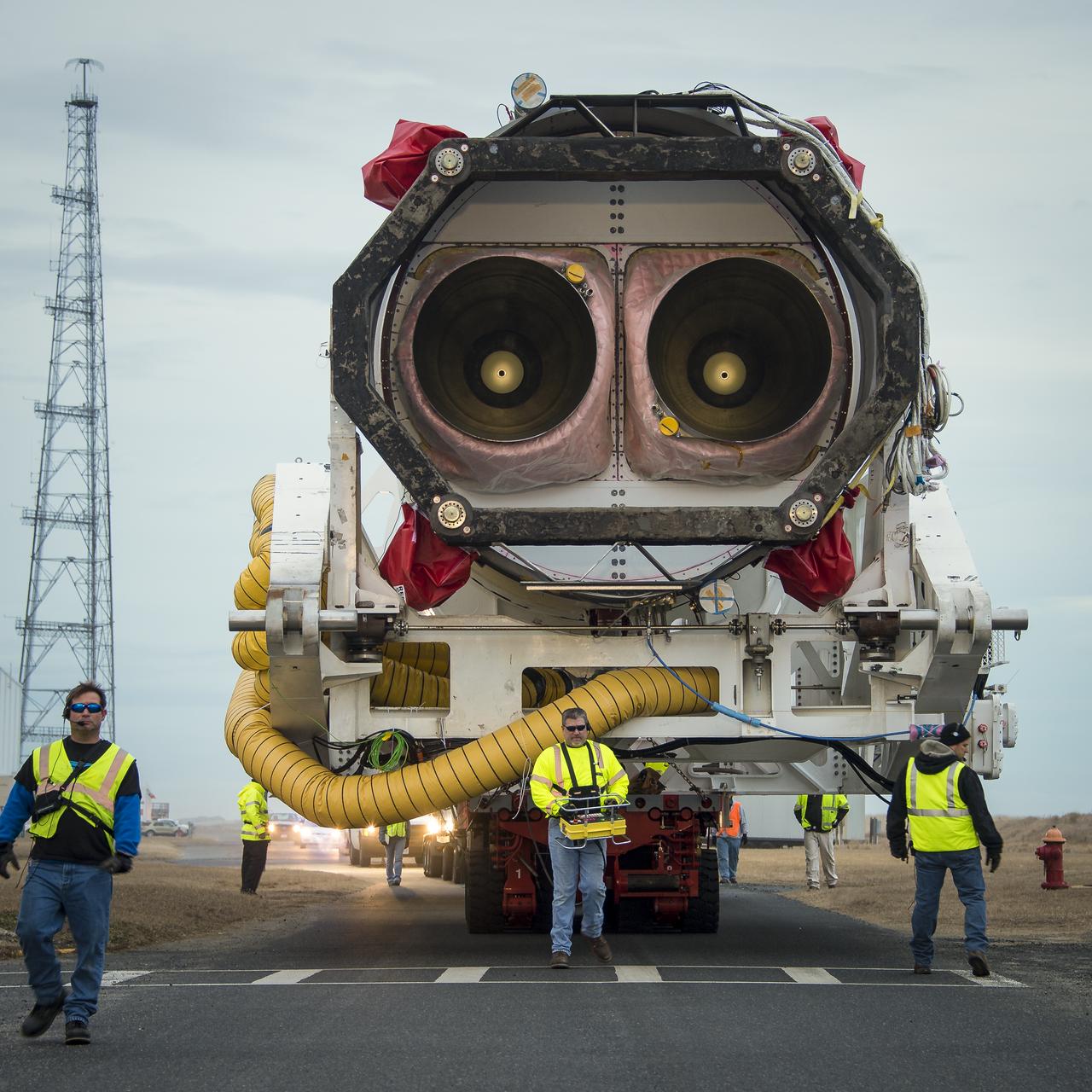 An Orbital Sciences Corporation Antares rocket is seen as it is rolled out to launch Pad-0A at NASA's Wallops Flight Facility, Sunday, January 5, 2014 in advance of a planned Wednesday, Jan. 8th, 1:32 p.m. EST launch, Wallops Island, VA. The Antares will launch a Cygnus spacecraft on a cargo resupply mission to the International Space Station. The Orbital-1 mission is Orbital Sciences' first contracted cargo delivery flight to the space station for NASA. Among the cargo aboard Cygnus set to launch to the space station are science experiments, crew provisions, spare parts and other hardware. Photo Credit: (NASA/Bill Ingalls)