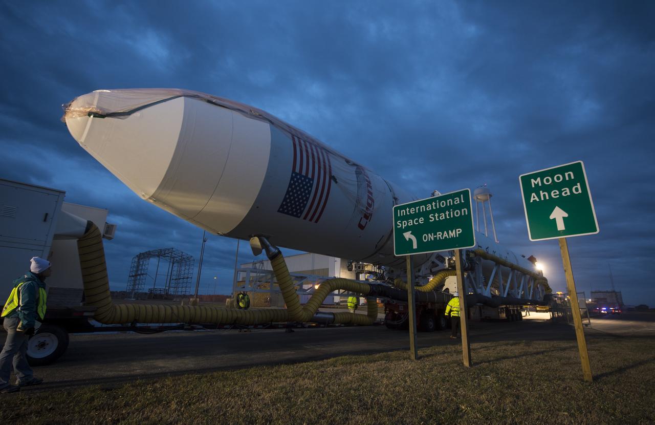 An Orbital Sciences Corporation Antares rocket is seen as it is rolled out to launch Pad-0A at NASA's Wallops Flight Facility, Sunday, January 5, 2014 in advance of a planned Wednesday, Jan. 8th, 1:32 p.m. EST launch, Wallops Island, VA. The Antares will launch a Cygnus spacecraft on a cargo resupply mission to the International Space Station. The Orbital-1 mission is Orbital Sciences' first contracted cargo delivery flight to the space station for NASA. Among the cargo aboard Cygnus set to launch to the space station are science experiments, crew provisions, spare parts and other hardware. Photo Credit: (NASA/Bill Ingalls)