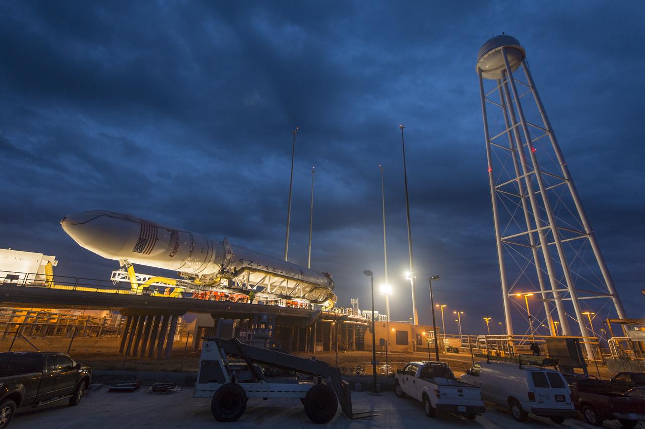 An Orbital Sciences Corporation Antares rocket is seen as it is rolled out to launch Pad-0A at NASA's Wallops Flight Facility, Sunday, January 5, 2014 in advance of a planned Wednesday, Jan. 8th, 1:32 p.m. EST launch, Wallops Island, VA. The Antares will launch a Cygnus spacecraft on a cargo resupply mission to the International Space Station. The Orbital-1 mission is Orbital Sciences' first contracted cargo delivery flight to the space station for NASA. Among the cargo aboard Cygnus set to launch to the space station are science experiments, crew provisions, spare parts and other hardware. Photo Credit: (NASA/Bill Ingalls)