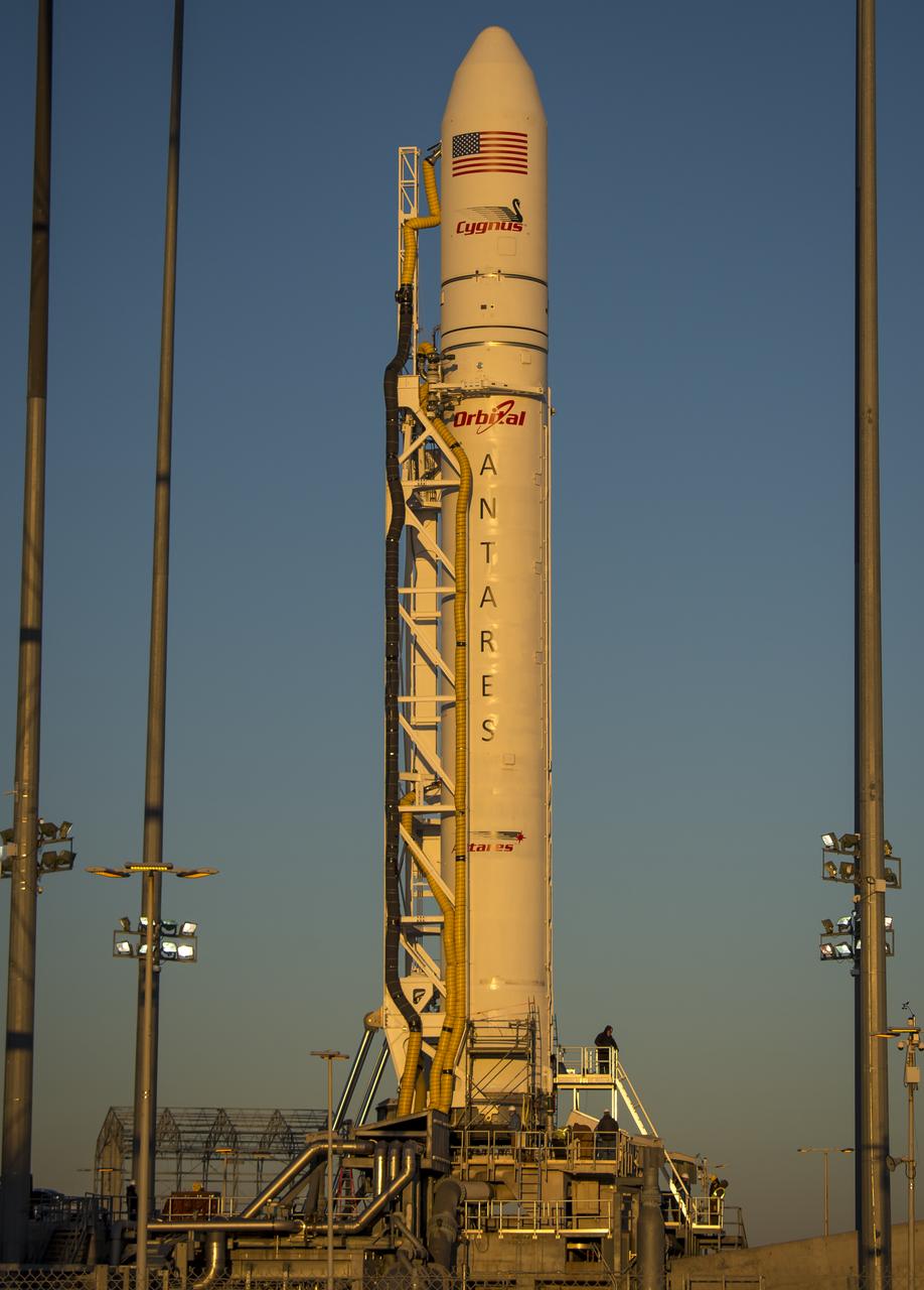 An Orbital Sciences Corporation Antares rocket is seen on launch Pad-0A at NASA's Wallops Flight Facility, Tuesday, January 7, 2014 in advance of a planned Wednesday, Jan. 8th, 1:32 p.m. EST launch, Wallops Island, VA. The Antares will launch a Cygnus spacecraft on a cargo resupply mission to the International Space Station. The Orbital-1 mission is Orbital Sciences' first contracted cargo delivery flight to the space station for NASA. Among the cargo aboard Cygnus set to launch to the space station are science experiments, crew provisions, spare parts and other hardware. Photo Credit: (NASA/Bill Ingalls)