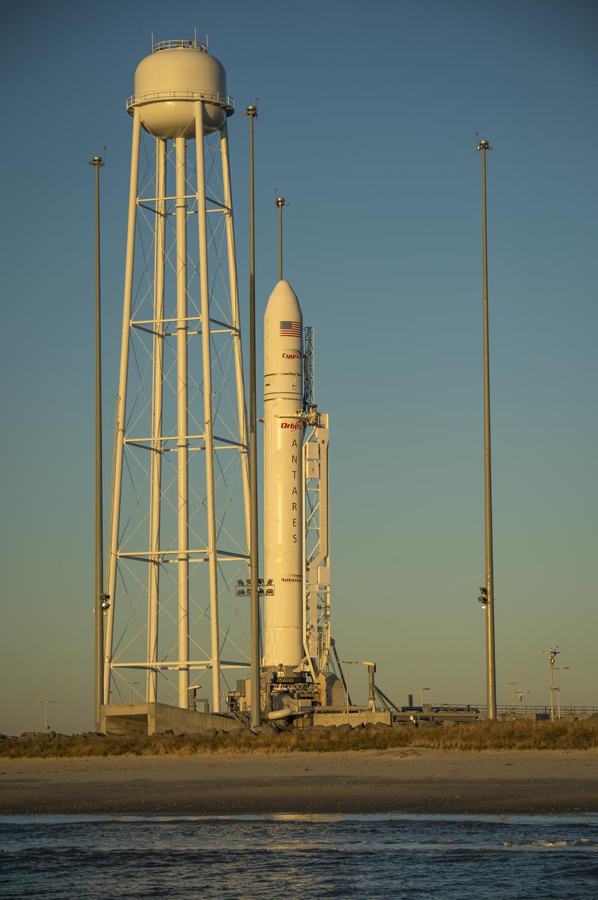 An Orbital Sciences Corporation Antares rocket is seen on launch Pad-0A during sunrise at NASA's Wallops Flight Facility, Wednesday, January 8, 2014, Wallops Island, VA. Early this morning, Orbital Sciences Corp. decided to scrub today’s launch attempt of the Antares rocket and the Cygnus cargo spacecraft on the company’s first resupply mission to the International Space Station due to an unusually high level of space radiation that exceeded constraints imposed on Antares. Photo Credit: (NASA/Bill Ingalls)