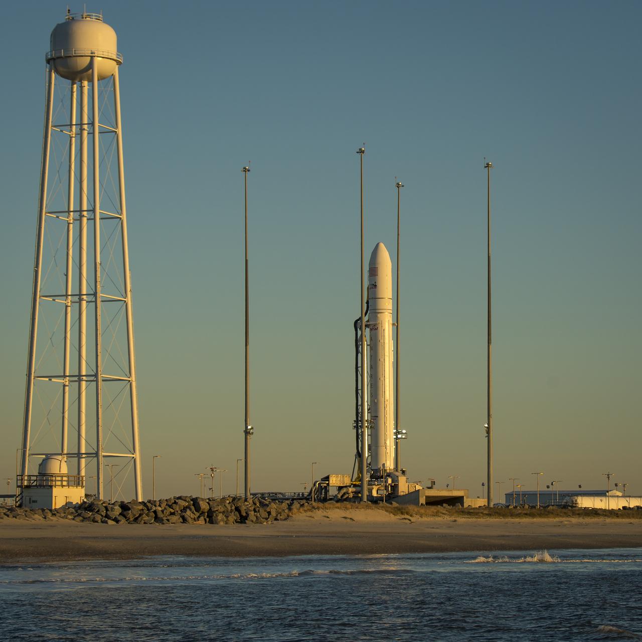 An Orbital Sciences Corporation Antares rocket is seen on launch Pad-0A during sunrise at NASA's Wallops Flight Facility, Wednesday, January 8, 2014, Wallops Island, VA. Early this morning, Orbital Sciences Corp. decided to scrub today’s launch attempt of the Antares rocket and the Cygnus cargo spacecraft on the company’s first resupply mission to the International Space Station due to an unusually high level of space radiation that exceeded constraints imposed on Antares. Photo Credit: (NASA/Bill Ingalls)