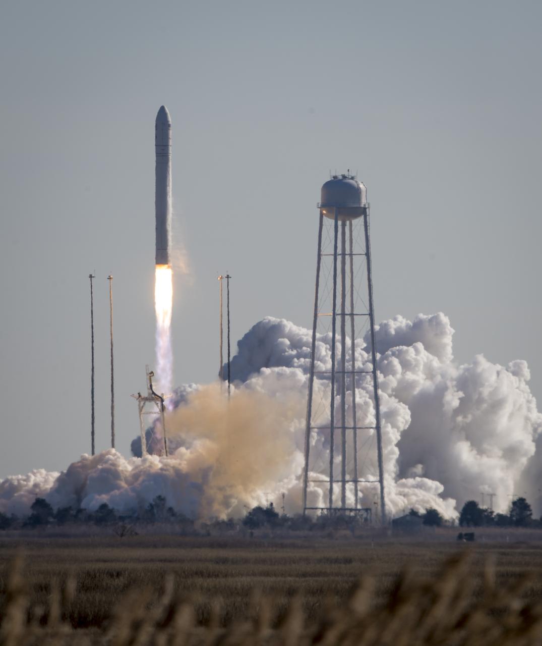 An Orbital Sciences Corporation Antares rocket is seen as it launches from Pad-0A at NASA's Wallops Flight Facility, Thursday, January 9, 2014, Wallops Island, VA. Antares is carrying the Cygnus spacecraft on a cargo resupply mission to the International Space Station. The Orbital-1 mission is Orbital Sciences' first contracted cargo delivery flight to the space station for NASA. Cygnus is carrying science experiments, crew provisions, spare parts and other hardware to the space station. Photo Credit: (NASA/Bill Ingalls)