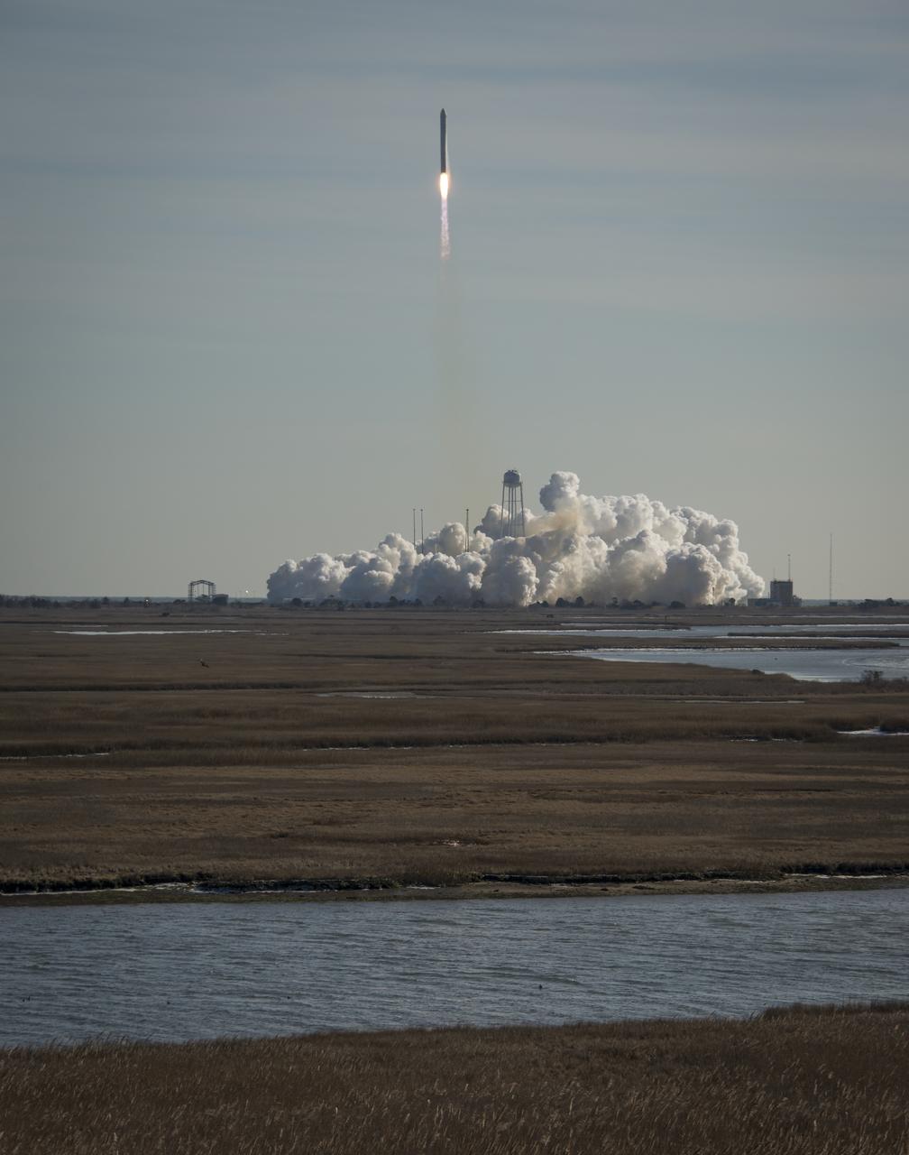 An Orbital Sciences Corporation Antares rocket is seen as it launches from Pad-0A at NASA's Wallops Flight Facility, Thursday, January 9, 2014, Wallops Island, VA. Antares is carrying the Cygnus spacecraft on a cargo resupply mission to the International Space Station. The Orbital-1 mission is Orbital Sciences' first contracted cargo delivery flight to the space station for NASA. Cygnus is carrying science experiments, crew provisions, spare parts and other hardware to the space station. Photo Credit: (NASA/Bill Ingalls)