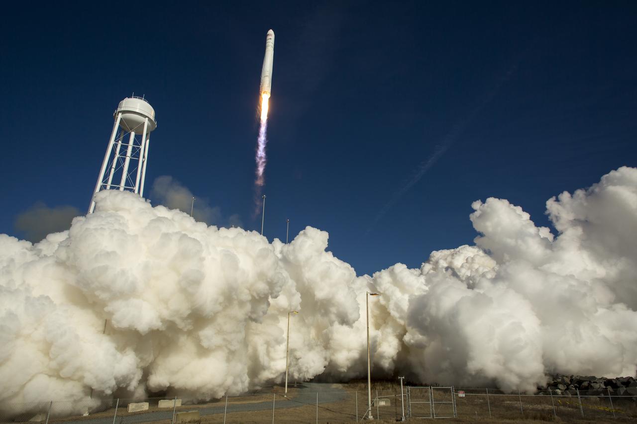 An Orbital Sciences Corporation Antares rocket is seen as it launches from Pad-0A at NASA's Wallops Flight Facility, Thursday, January 9, 2014, Wallops Island, VA. Antares is carrying the Cygnus spacecraft on a cargo resupply mission to the International Space Station. The Orbital-1 mission is Orbital Sciences' first contracted cargo delivery flight to the space station for NASA. Cygnus is carrying science experiments, crew provisions, spare parts and other hardware to the space station. Photo Credit: (NASA/Bill Ingalls)