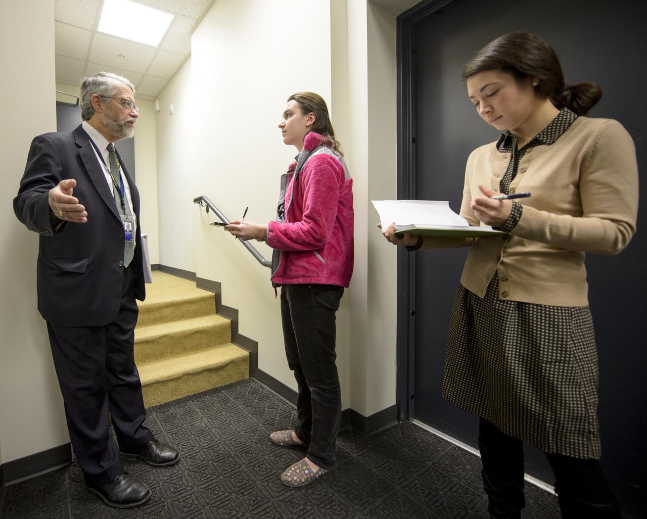 Dr. John P. Holdren, Assistant to the President for Science and Technology and Director of the White House Office of Science & Technology Policy, left, is interviewed by TIME for Kids reporter Kristen Rigsby, as Moira Vahey, Deputy Assistant Director for Strategic Communications at the White House Office of Science & Technology Policy, right, takes notes ahead of the annual White House State of Science, Technology, Engineering, and Math (SoSTEM) address, Wednesday, Jan. 29, 2014, in the South Court Auditorium in the Eisenhower Executive Office Building on the White House complex in Washington. Photo Credit: (NASA/Bill Ingalls)