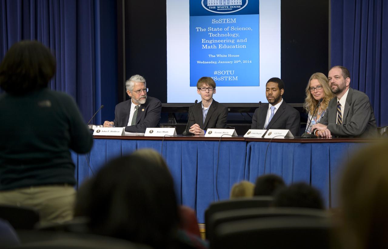 Panels participants, from left, Dr. John P. Holdren, Assistant to the President for Science and Technology and Director of the White House Office of Science & Technology Policy, former White House Science Fair participant Joey Hudy, Environmentalist and third-year law student at Elon University School of Law Tyrone Davis, White House innovation expert Cristin Dorgelo, and Defense Advanced Research Projects Agency (DARPA) Gill Pratt, take a question from the audience during the annual White House State of Science, Technology, Engineering, and Math (SoSTEM) address, Wednesday, Jan. 29, 2014, in the South Court Auditorium in the Eisenhower Executive Office Building on the White House complex in Washington. Photo Credit: (NASA/Bill Ingalls)