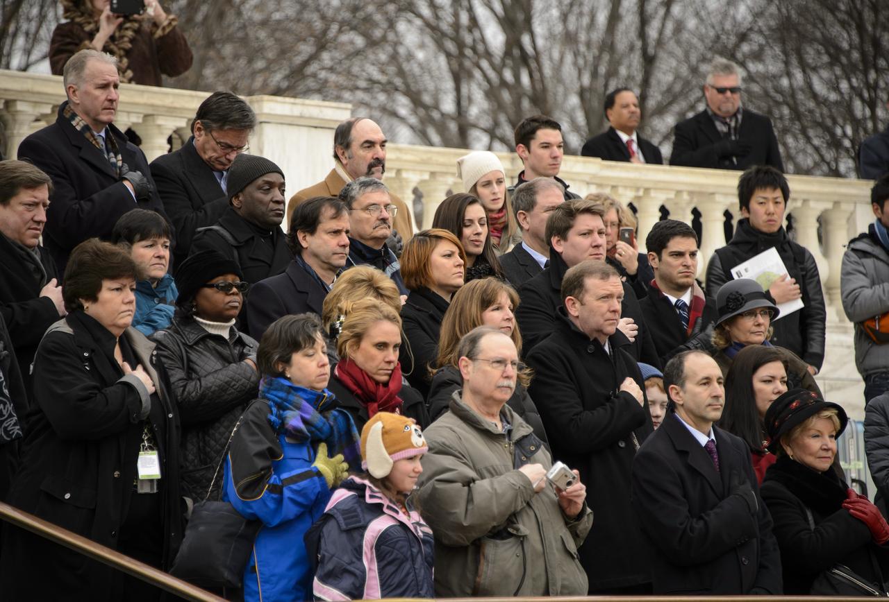 NASA personnel, family members of those lost in Challenger, Columbia, Apollo 1 and members of the public watch as a wreath is laid at the Tomb of the Unknowns by NASA Administrator Charles Bolden as part of NASA's Day of Remembrance, Friday, Jan. 31, 2014, at Arlington National Cemetery.  The wreaths were laid in memory of those men and women who lost their lives in the quest for space exploration.  Photo Credit: (NASA/Bill Ingalls)