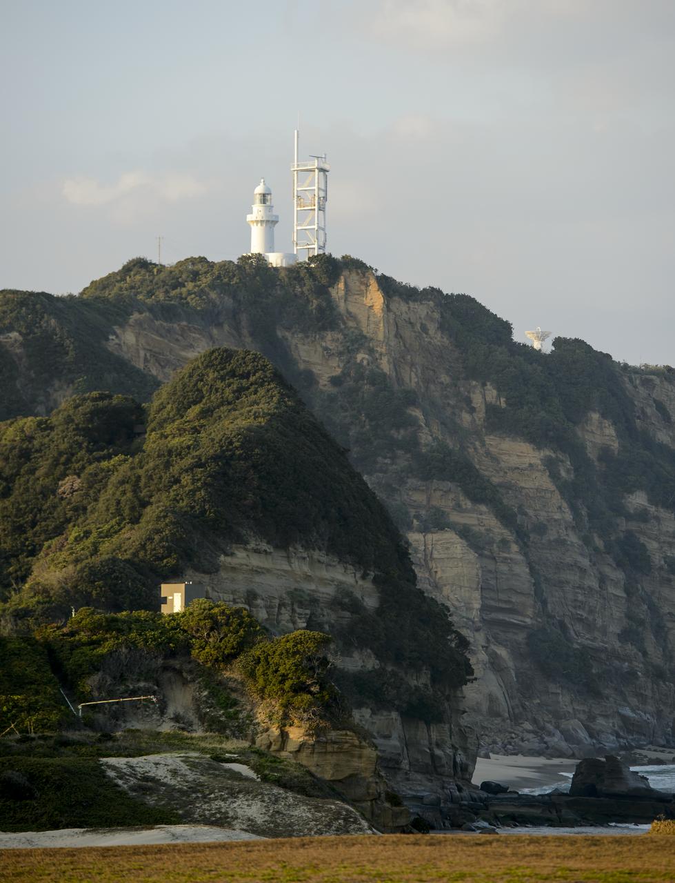 A light house and weather station is seen at the Japan Aerospace Exploration Agency’s (JAXA) Tanegashima Space Center (TNSC) a week ahead of the planned launch of an H-IIA rocket carrying the Global Precipitation Measurement (GPM) Core Observatory, Friday, Feb. 21, 2014, Tanegashima Island, Japan. The NASA-JAXA GPM spacecraft will collect information that unifies data from an international network of existing and future satellites to map global rainfall and snowfall every three hours. Photo Credit: (NASA/Bill Ingalls)
