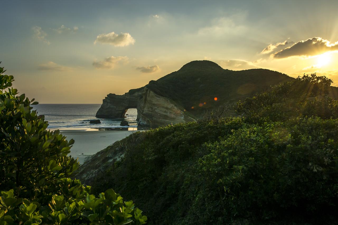 The sun sets just outside the Japan Aerospace Exploration Agency’s (JAXA) Tanegashima Space Center (TNSC) a week ahead of the planned launch of an H-IIA rocket carrying the Global Precipitation Measurement (GPM) Core Observatory, Friday, Feb. 21, 2014, Tanegashima Island, Japan. The NASA-JAXA GPM spacecraft will collect information that unifies data from an international network of existing and future satellites to map global rainfall and snowfall every three hours. Photo Credit: (NASA/Bill Ingalls)