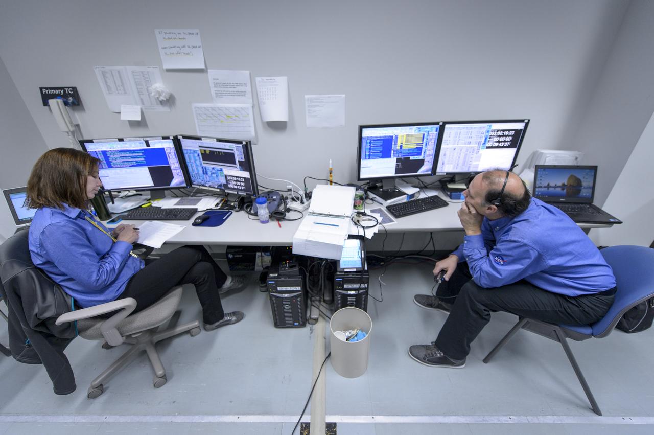 NASA GPM Test Conductors, Michelle Lacombe, left, and Bill Dehaven participate in an all-day launch simulation for the Global Precipitation Measurement (GPM) Core Observatory at the Spacecraft Test and Assembly Building 2 (STA2), Saturday, Feb. 22, 2014, Tanegashima Space Center (TNSC), Tanegashima Island, Japan. Japan Aerospace Exploration Agency (JAXA) plans to launch an H-IIA rocket carrying the GPM Core Observatory on Feb. 28, 2014. The NASA-JAXA GPM spacecraft will collect information that unifies data from an international network of existing and future satellites to map global rainfall and snowfall every three hours. Photo Credit: (NASA/Bill Ingalls)