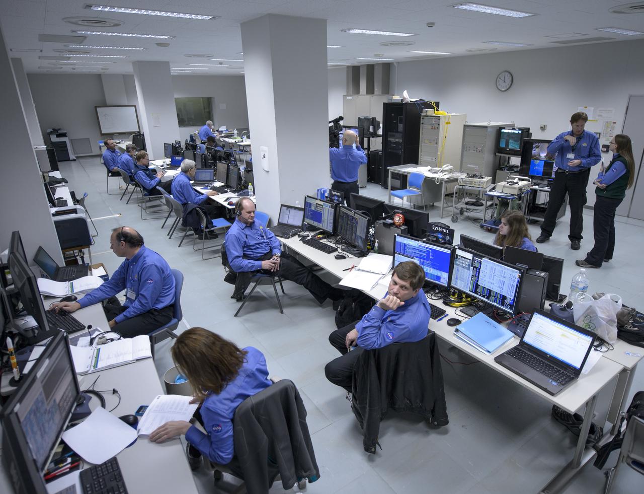 The NASA Global Precipitation Measurement (GPM) Core Observatory team is seen during an all-day launch simulation for GPM at the Spacecraft Test and Assembly Building 2 (STA2), Saturday, Feb. 22, 2014, Tanegashima Space Center (TNSC), Tanegashima Island, Japan. Japan Aerospace Exploration Agency (JAXA) plans to launch an H-IIA rocket carrying the GPM Core Observatory on Feb. 28, 2014. The NASA-JAXA GPM spacecraft will collect information that unifies data from an international network of existing and future satellites to map global rainfall and snowfall every three hours. Photo Credit: (NASA/Bill Ingalls)