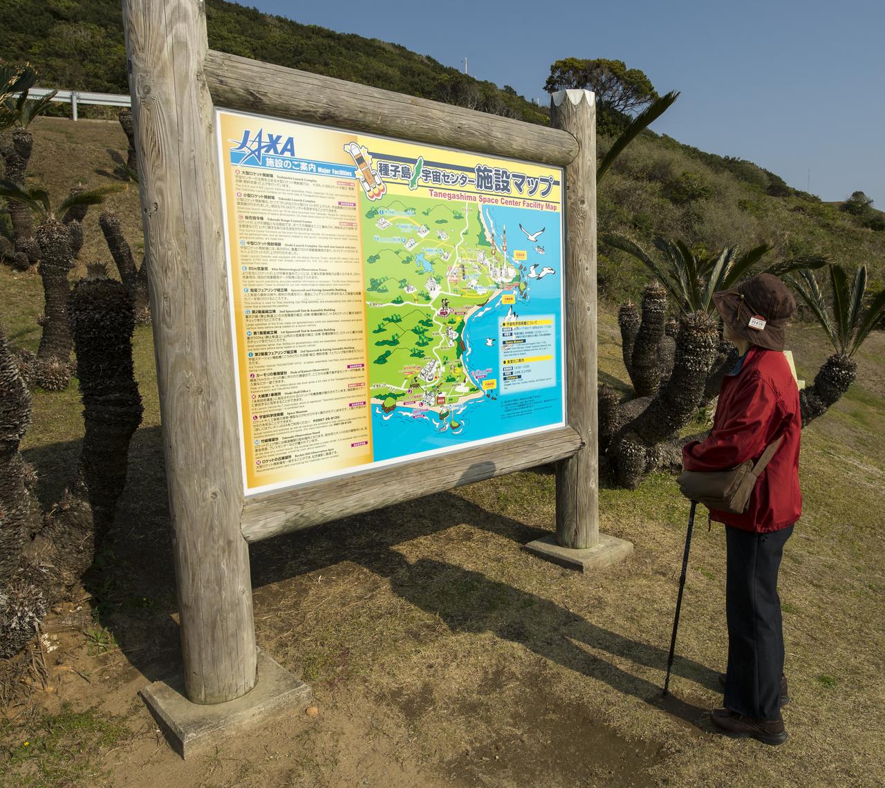 A visitor looks over a Tanegashima Space Center (TNSC) Facility Map, Sunday, Feb. 23, 2014, Tanegashima Island, Japan. A Japanese H-IIA rocket carrying the NASA-Japan Aerospace Exploration Agency's (JAXA), Global Precipitation Measurement (GPM) Core Observatory is planned for launch from the space center on Feb. 28, 2014. Once launched, the GPM spacecraft will collect information that unifies data from an international network of existing and future satellites to map global rainfall and snowfall every three hours.  Photo Credit: (NASA/Bill Ingalls)