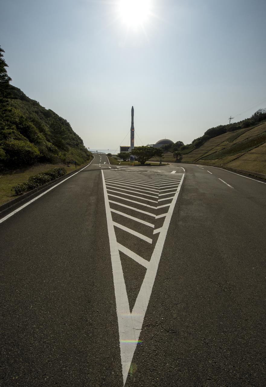 A rocket is seen at the entrance to the visitor's center of the Tanegashima Space Center (TNSC), Sunday, Feb. 23, 2014, Tanegashima Island, Japan. A Japanese H-IIA rocket carrying the NASA-Japan Aerospace Exploration Agency (JAXA), Global Precipitation Measurement (GPM) Core Observatory is planned for launch from the space center on Feb. 28, 2014. Once launched, the GPM spacecraft will collect information that unifies data from an international network of existing and future satellites to map global rainfall and snowfall every three hours.  Photo Credit: (NASA/Bill Ingalls)