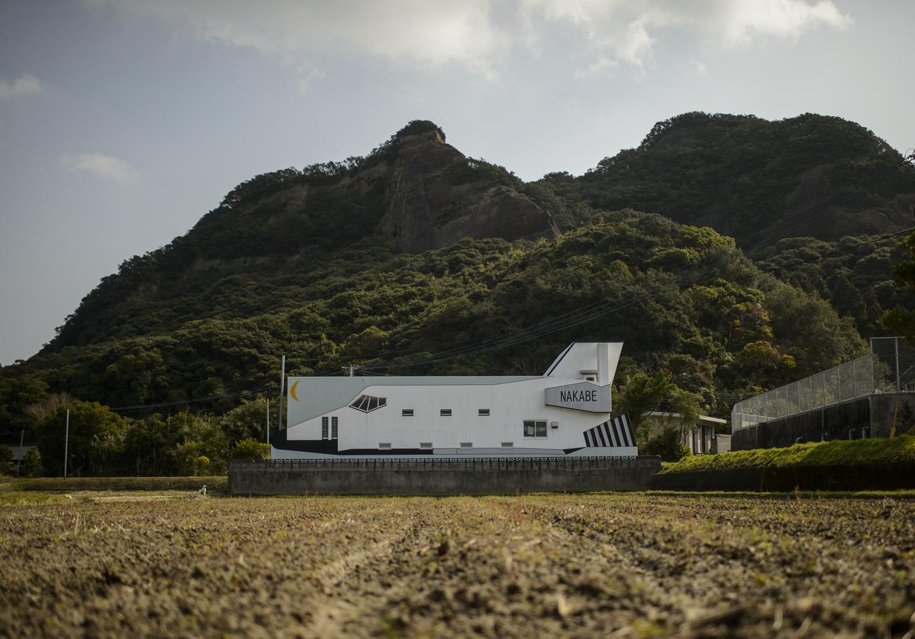 A building designed to look like a space shuttle is seen a few kilometers outside of the Tanegashima Space Center (TNSC), Sunday, Feb. 23, 2014, Tanegashima Island, Japan. A Japanese H-IIA rocket carrying the NASA-Japan Aerospace Exploration Agency (JAXA), Global Precipitation Measurement (GPM) Core Observatory is planned for launch from the space center on Feb. 28, 2014. Once launched, the GPM spacecraft will collect information that unifies data from an international network of existing and future satellites to map global rainfall and snowfall every three hours.  Photo Credit: (NASA/Bill Ingalls)