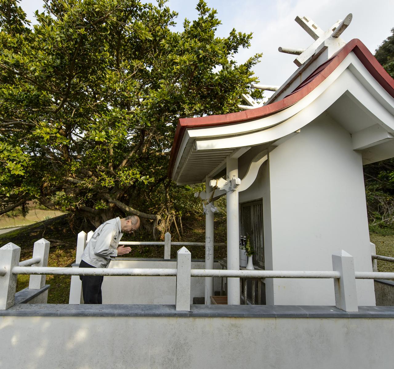 Masahiro Kojima, GPM Dual-frequency Precipitation Radar project manager, Japan Aerospace Exploration Agency (JAXA), Tsukuba, bows at the Ebisu Shrine, the first shrine in a traditional San-ja Mairi, or Three Shrine Pilgrimage, in which members of the JAXA team pray for a successful launch, Tuesday, Feb. 25, 2014, Tanegashima Island, Japan. A Japanese H-IIA rocket carrying the NASA-JAXA, Global Precipitation Measurement (GPM) Core Observatory is planned for launch from the Tanegashima Space Center (TNSC) on Feb. 28, 2014. Once launched, the GPM spacecraft will collect information that unifies data from an international network of existing and future satellites to map global rainfall and snowfall every three hours.  Photo Credit: (NASA/Bill Ingalls)