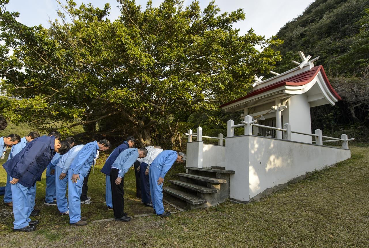 Japan Aerospace Exploration Agency (JAXA) team members bow at the Ebisu Shrine, the first shrine in a traditional San-ja Mairi, or Three Shrine Pilgrimage, where the team prays for a successful launch, Tuesday, Feb. 25, 2014, Tanegashima Island, Japan. A Japanese H-IIA rocket carrying the NASA-JAXA, Global Precipitation Measurement (GPM) Core Observatory is planned for launch from the Tanegashima Space Center (TNSC) on Feb. 28, 2014. Once launched, the GPM spacecraft will collect information that unifies data from an international network of existing and future satellites to map global rainfall and snowfall every three hours.  Photo Credit: (NASA/Bill Ingalls)
