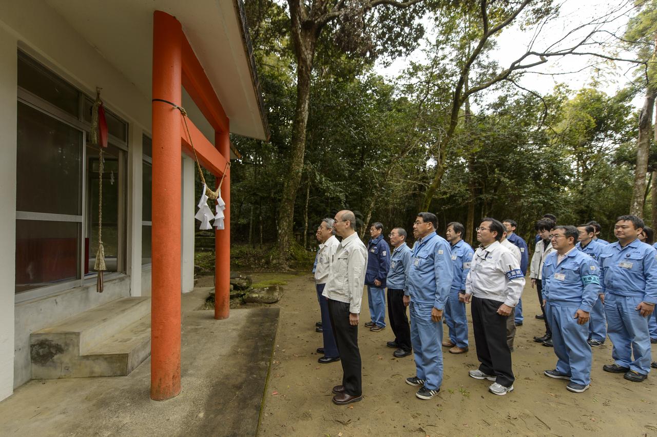 Japan Aerospace Exploration Agency (JAXA) team members stand before at the Kawachi Shrine, the second shrine in a traditional San-ja Mairi, or Three Shrine Pilgrimage, where the team prays for a successful launch, Tuesday, Feb. 25, 2014, Tanegashima Island, Japan. A Japanese H-IIA rocket carrying the NASA-JAXA, Global Precipitation Measurement (GPM) Core Observatory is planned for launch from the Tanegashima Space Center (TNSC)  on Feb. 28, 2014. Once launched, the GPM spacecraft will collect information that unifies data from an international network of existing and future satellites to map global rainfall and snowfall every three hours.  Photo Credit: (NASA/Bill Ingalls)