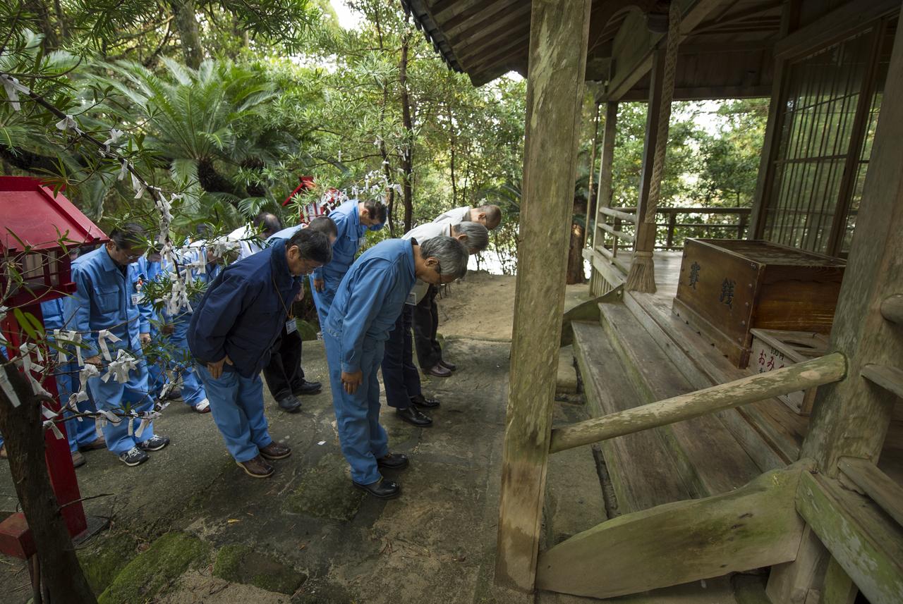 Japan Aerospace Exploration Agency (JAXA) team members pray at the Houman Shrine, the third, and final, shrine in a traditional San-ja Mairi, or Three Shrine Pilgrimage, where the team prays for a successful launch, Tuesday, Feb. 25, 2014, Tanegashima Island, Japan. A Japanese H-IIA rocket carrying the NASA-JAXA, Global Precipitation Measurement (GPM) Core Observatory is planned for launch from the Tanegashima Space Center (TNSC) on Feb. 28, 2014. Once launched, the GPM spacecraft will collect information that unifies data from an international network of existing and future satellites to map global rainfall and snowfall every three hours.  Photo Credit: (NASA/Bill Ingalls)
