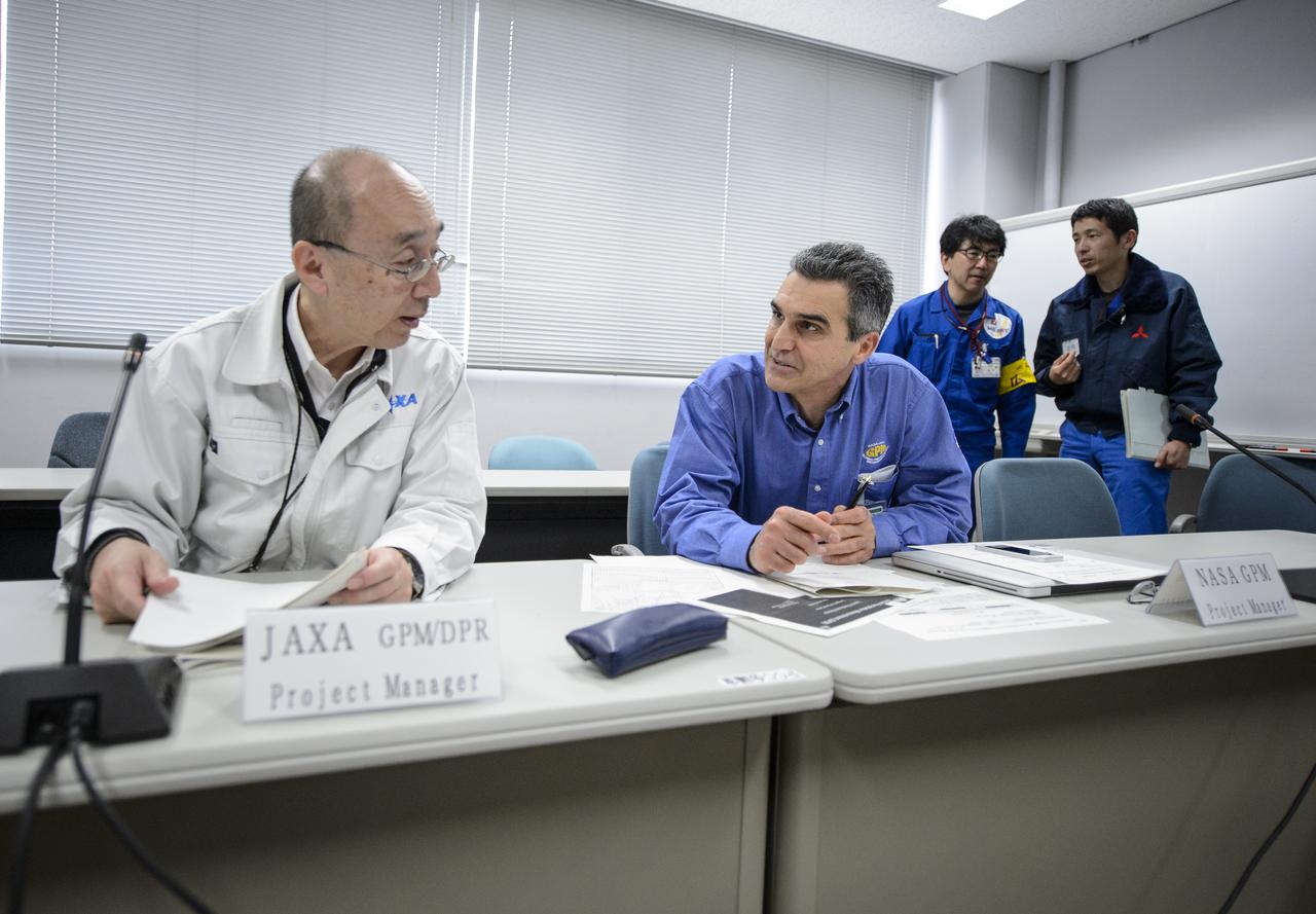 Masahiro Kojima, GPM Dual-frequency Precipitation Radar project manager, Japan Aerospace Exploration Agency (JAXA), left, and, Art Azarbarzin, NASA Global Precipitation Measurement (GPM) project manager, talk after the GPM Launch Readiness Review (LRR), Wednesday, Feb. 26, 2014 at Tanegashima Space Center, Japan. The GPM spacecraft is scheduled to launch aboard an H-IIA rocket early on the morning of Feb. 28 Japan time.  At the meeting in the space center's Range Control Center, all preparations to date were reviewed and approval was given to proceed with launch on schedule.  Once launched, the GPM spacecraft will collect information that unifies data from an international network of existing and future satellites to map global rainfall and snowfall every three hours.  Photo Credit: (NASA/Bill Ingalls)