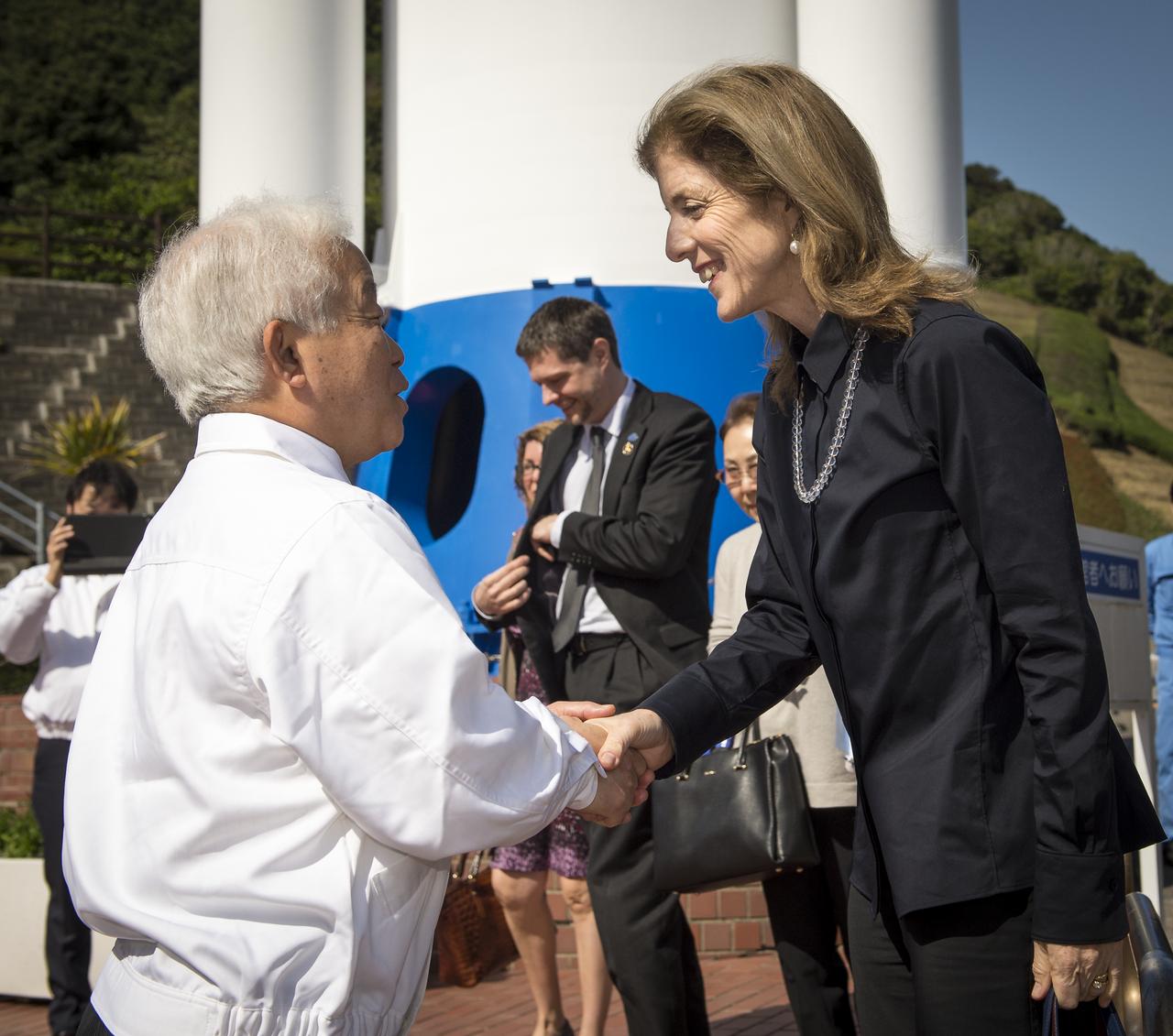 Caroline Kennedy, U.S. Ambassador Extraordinary and Plenipotentiary to Japan, right, is welcomed by Japan Aerospace Exploration Agency (JAXA), President, Naoki Okumura, at the Tanegashima Space Center Visitors Center on Thursday, Feb. 27, 2014, Tanegashima, Japan.  The Ambassador is visiting the space center and hopes to witness the planned launch of a Japanese H-IIA rocket carrying the NASA-JAXA, Global Precipitation Measurement (GPM) Core Observatory. Once launched, the GPM spacecraft will collect information that unifies data from an international network of existing and future satellites to map global rainfall and snowfall every three hours.  Photo Credit: (NASA/Bill Ingalls)