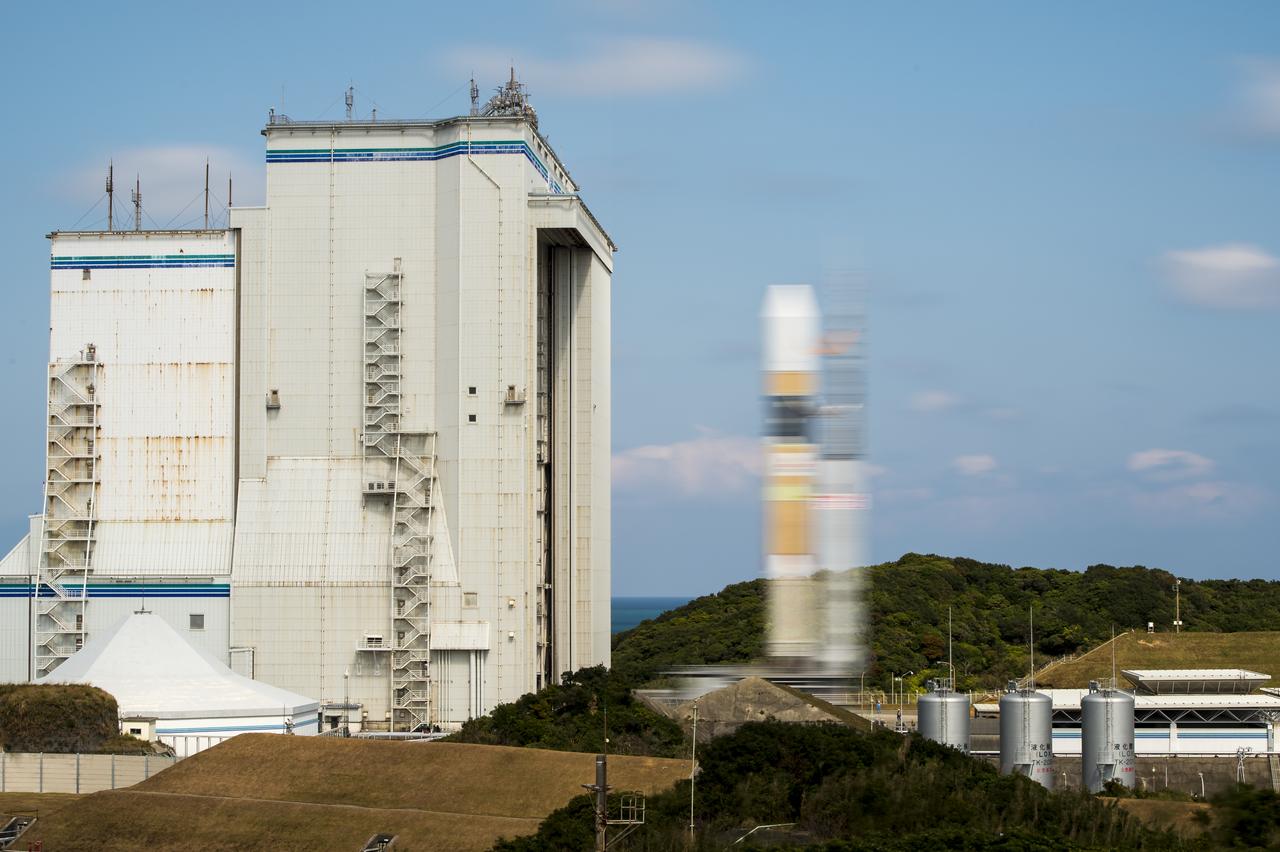 A Japanese H-IIA rocket carrying the NASA-Japan Aerospace Exploration Agency (JAXA), Global Precipitation Measurement (GPM) Core Observatory is seen in this 10 second exposure as it rolls out to launch pad 1 of the Tanegashima Space Center, Thursday, Feb. 27, 2014, Tanegashima, Japan. Once launched, the GPM spacecraft will collect information that unifies data from an international network of existing and future satellites to map global rainfall and snowfall every three hours.  Photo Credit: (NASA/Bill Ingalls)