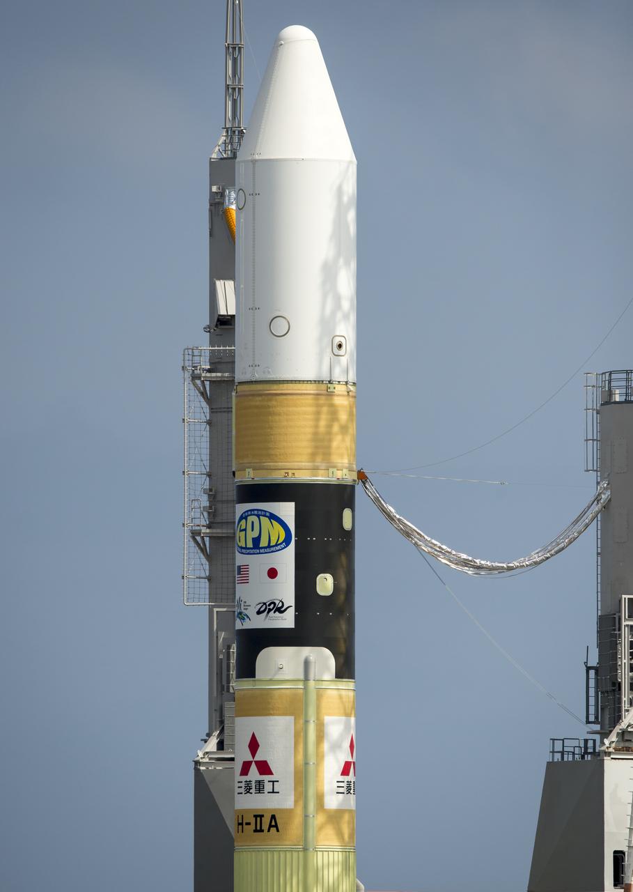 A Japanese H-IIA rocket carrying the NASA-Japan Aerospace Exploration Agency (JAXA), Global Precipitation Measurement (GPM) Core Observatory is seen as it rolls out to launch pad 1 of the Tanegashima Space Center, Thursday, Feb. 27, 2014, Tanegashima, Japan. Once launched, the GPM spacecraft will collect information that unifies data from an international network of existing and future satellites to map global rainfall and snowfall every three hours.  Photo Credit: (NASA/Bill Ingalls)