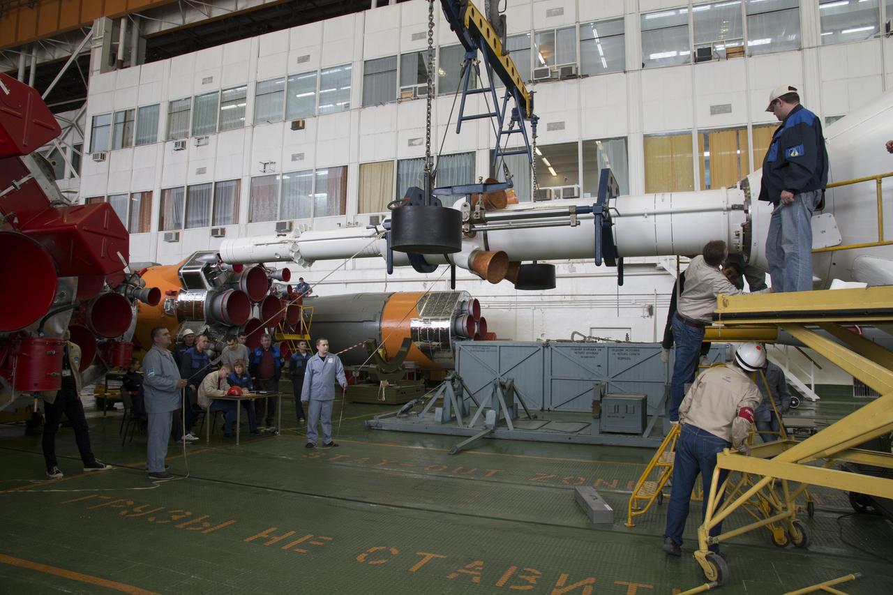 The Soyuz rocket and Soyuz TMA-12M spacecraft are assembled at Building 112 on the Baikonur Cosmodrome on Saturday, March 22, 2014 in Baikonur, Kazakhstan. Launch of the Soyuz is scheduled for March 26 and will send Expedition 39 Soyuz Commander Alexander Skvortsov of the Russian Federal Space Agency, Roscosmos, Flight Engineer Steven Swanson of NASA, and Flight Engineer Oleg Artemyev of Roscosmos on a six month mission to the International Space Station.  Photo Credit: (NASA/Victor Zelentsov)