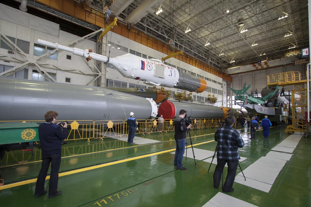 The Soyuz rocket and Soyuz TMA-12M spacecraft are assembled at Building 112 on the Baikonur Cosmodrome on Saturday, March 22, 2014 in Baikonur, Kazakhstan. Launch of the Soyuz is scheduled for March 26 and will send Expedition 39 Soyuz Commander Alexander Skvortsov of the Russian Federal Space Agency, Roscosmos, Flight Engineer Steven Swanson of NASA, and Flight Engineer Oleg Artemyev of Roscosmos on a six month mission to the International Space Station.  Photo Credit: (NASA/Victor Zelentsov)