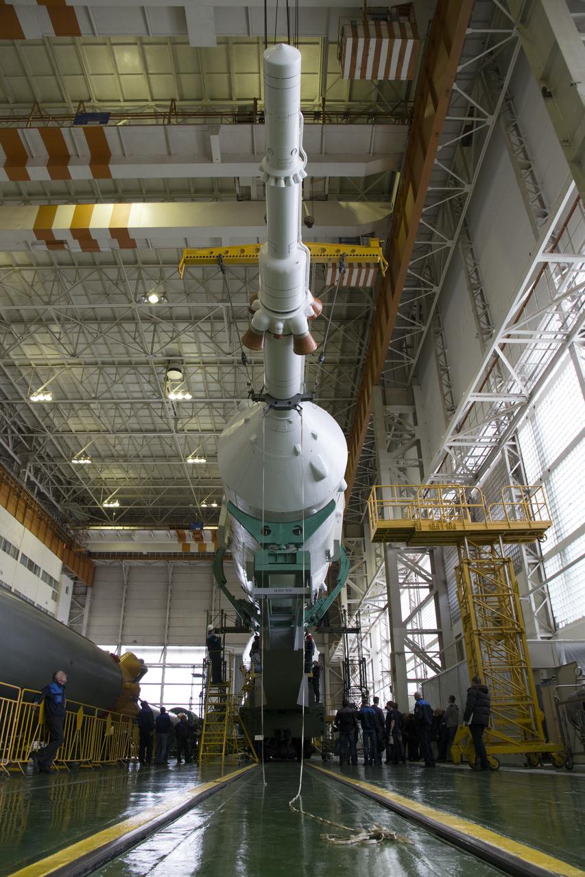 The Soyuz rocket and Soyuz TMA-12M spacecraft are assembled at Building 112 on the Baikonur Cosmodrome on Saturday, March 22, 2014 in Baikonur, Kazakhstan. Launch of the Soyuz is scheduled for March 26 and will send Expedition 39 Soyuz Commander Alexander Skvortsov of the Russian Federal Space Agency, Roscosmos, Flight Engineer Steven Swanson of NASA, and Flight Engineer Oleg Artemyev of Roscosmos on a six month mission to the International Space Station.  Photo Credit: (NASA/Victor Zelentsov)