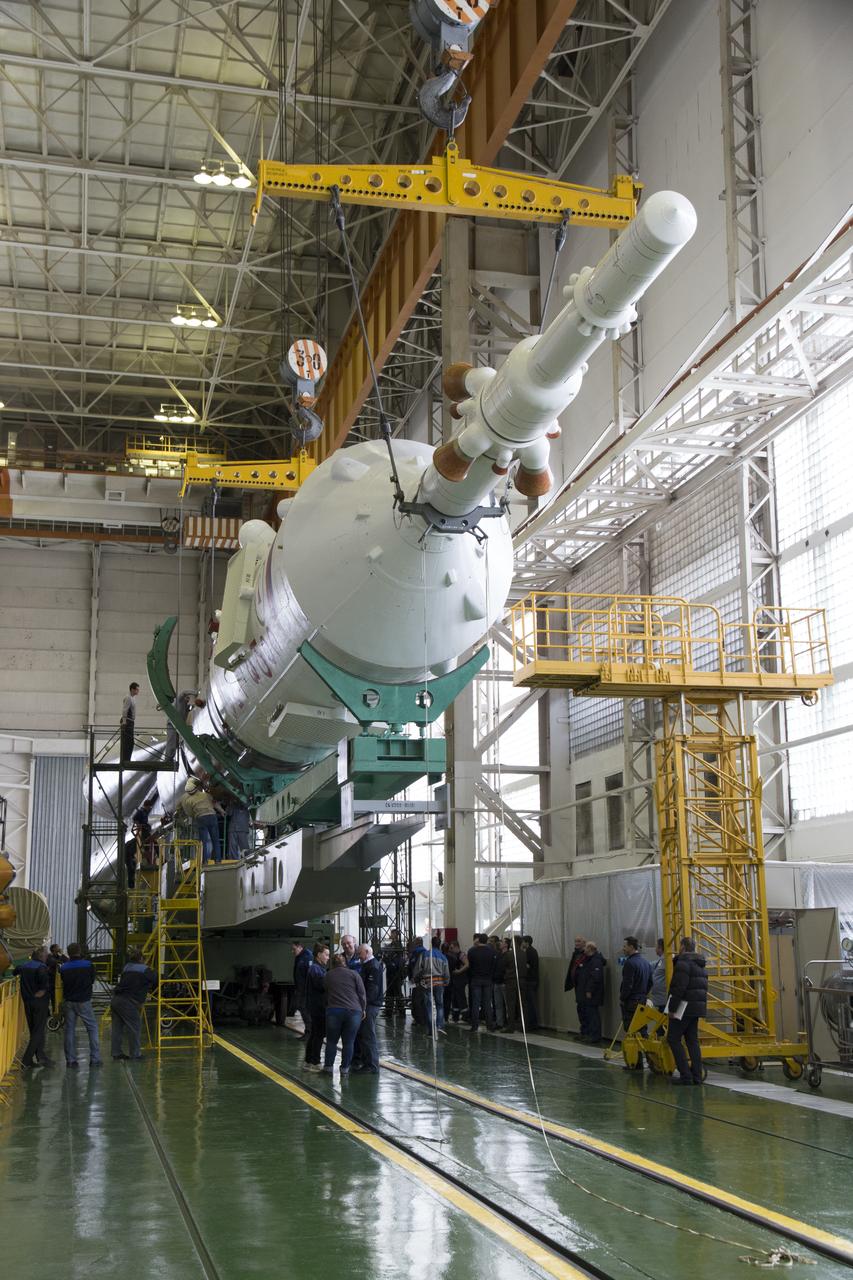 The Soyuz rocket and Soyuz TMA-12M spacecraft are assembled at Building 112 on the Baikonur Cosmodrome on Saturday, March 22, 2014 in Baikonur, Kazakhstan. Launch of the Soyuz is scheduled for March 26 and will send Expedition 39 Soyuz Commander Alexander Skvortsov of the Russian Federal Space Agency, Roscosmos, Flight Engineer Steven Swanson of NASA, and Flight Engineer Oleg Artemyev of Roscosmos on a six month mission to the International Space Station.  Photo Credit: (NASA/Victor Zelentsov)
