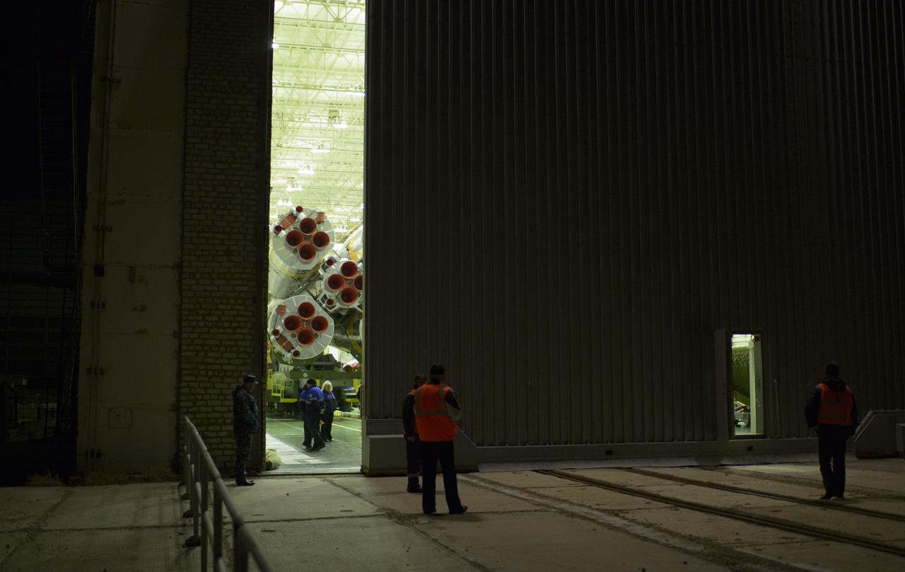 The doors to Building 112 are opened to reveal the Soyuz TMA-12M spacecraft as it is prepared to be rolled out to the launch pad by train on Sunday, March 23, 2014, at the Baikonur Cosmodrome in Kazakhstan.  Launch of the Soyuz rocket is scheduled for March 26 and will send Expedition 39 Soyuz Commander Alexander Skvortsov of the Russian Federal Space Agency, Roscosmos, Flight Engineer Steven Swanson of NASA, and Flight Engineer Oleg Artemyev of Roscosmos on a six-month mission aboard the International Space Station.  Photo Credit: (NASA/Joel Kowsky)