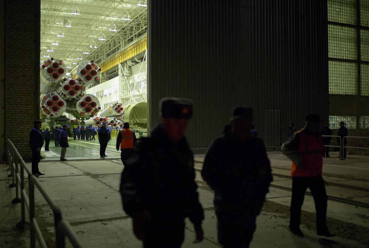 The doors to Building 112 are opened to reveal the Soyuz TMA-12M spacecraft as it is prepared to be rolled out to the launch pad by train on Sunday, March 23, 2014, at the Baikonur Cosmodrome in Kazakhstan.  Launch of the Soyuz rocket is scheduled for March 26 and will send Expedition 39 Soyuz Commander Alexander Skvortsov of the Russian Federal Space Agency, Roscosmos, Flight Engineer Steven Swanson of NASA, and Flight Engineer Oleg Artemyev of Roscosmos on a six-month mission aboard the International Space Station.  Photo Credit: (NASA/Joel Kowsky)