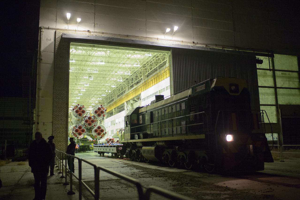 The Soyuz TMA-12M spacecraft is prepared to be rolled out to the launch pad by train on Sunday, March 23, 2014, at the Baikonur Cosmodrome in Kazakhstan.  Launch of the Soyuz rocket is scheduled for March 26 and will send Expedition 39 Soyuz Commander Alexander Skvortsov of the Russian Federal Space Agency, Roscosmos, Flight Engineer Steven Swanson of NASA, and Flight Engineer Oleg Artemyev of Roscosmos on a six-month mission aboard the International Space Station.  Photo Credit: (NASA/Joel Kowsky)