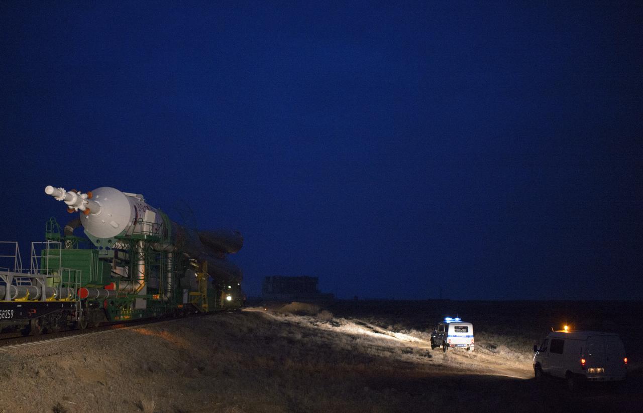 The Soyuz TMA-12M spacecraft is rolled out to the launch pad by train on Sunday, March 23, 2014, at the Baikonur Cosmodrome in Kazakhstan. Launch of the Soyuz rocket is scheduled for March 26 and will send Expedition 39 Soyuz Commander Alexander Skvortsov of the Russian Federal Space Agency, Roscosmos, Flight Engineer Steven Swanson of NASA, and Flight Engineer Oleg Artemyev of Roscosmos on a six-month mission aboard the International Space Station. Photo Credit: (NASA/Joel Kowsky)