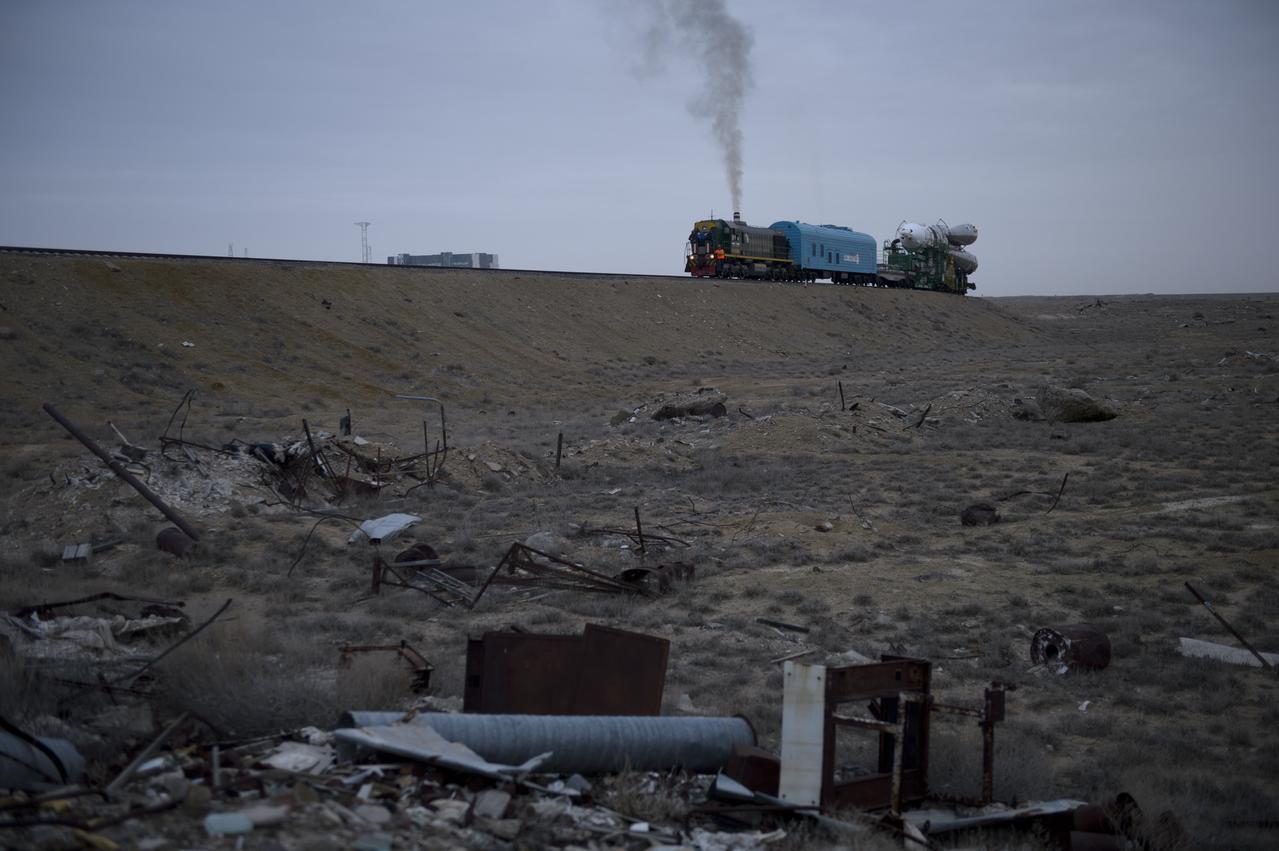 The Soyuz TMA-12M spacecraft is rolled out to the launch pad by train on Sunday, March 23, 2014, at the Baikonur Cosmodrome in Kazakhstan. Launch of the Soyuz rocket is scheduled for March 26 and will send Expedition 39 Soyuz Commander Alexander Skvortsov of the Russian Federal Space Agency, Roscosmos, Flight Engineer Steven Swanson of NASA, and Flight Engineer Oleg Artemyev of Roscosmos on a six-month mission aboard the International Space Station. Photo Credit: (NASA/Joel Kowsky)