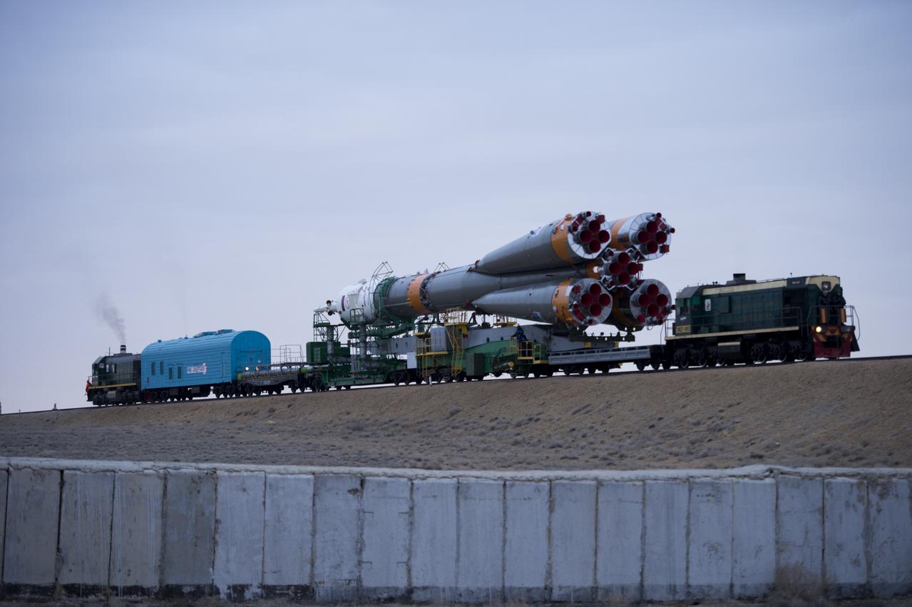 The Soyuz TMA-12M spacecraft is rolled out to the launch pad by train on Sunday, March 23, 2014, at the Baikonur Cosmodrome in Kazakhstan.  Launch of the Soyuz rocket is scheduled for March 26 and will send Expedition 39 Soyuz Commander Alexander Skvortsov of the Russian Federal Space Agency, Roscosmos, Flight Engineer Steven Swanson of NASA, and Flight Engineer Oleg Artemyev of Roscosmos on a six-month mission aboard the International Space Station.  Photo Credit: (NASA/Joel Kowsky)