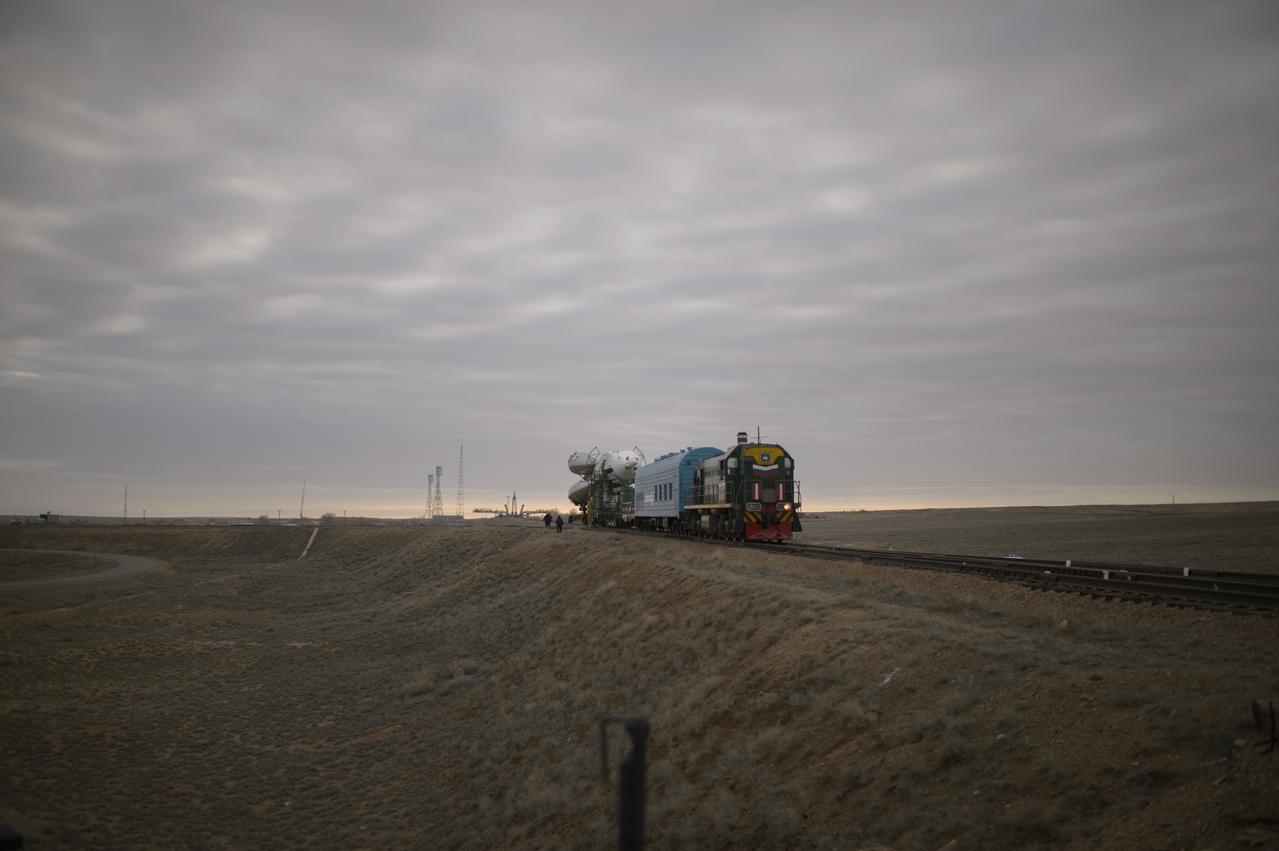The Soyuz TMA-12M spacecraft is rolled out to the launch pad by train on Sunday, March 23, 2014, at the Baikonur Cosmodrome in Kazakhstan.  Launch of the Soyuz rocket is scheduled for March 26 and will send Expedition 39 Soyuz Commander Alexander Skvortsov of the Russian Federal Space Agency, Roscosmos, Flight Engineer Steven Swanson of NASA, and Flight Engineer Oleg Artemyev of Roscosmos on a six-month mission aboard the International Space Station.  Photo Credit: (NASA/Joel Kowsky)