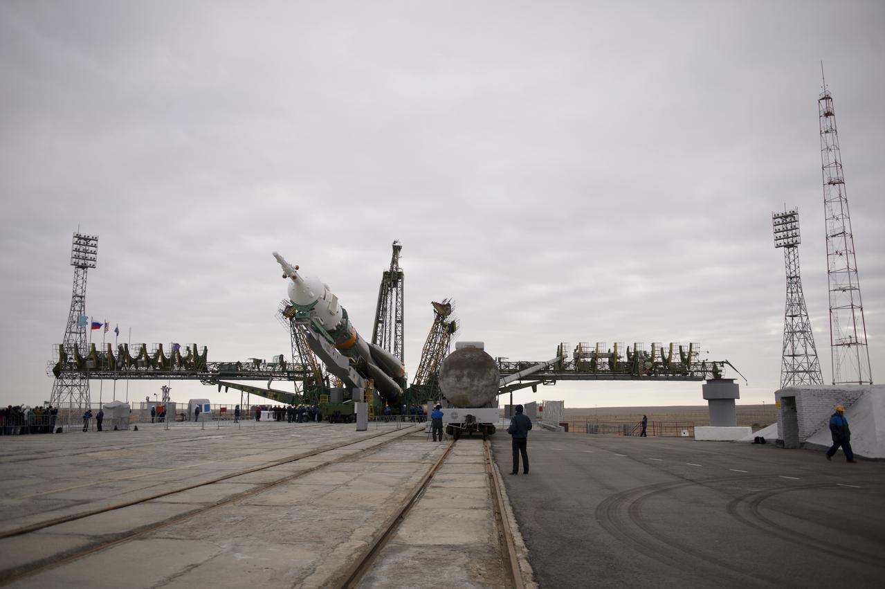 The Soyuz TMA-12M spacecraft is raised into position on the launch pad on Sunday, March 23, 2014, at the Baikonur Cosmodrome in Kazakhstan.  Launch of the Soyuz rocket is scheduled for March 26 and will send Expedition 39 Soyuz Commander Alexander Skvortsov of the Russian Federal Space Agency, Roscosmos, Flight Engineer Steven Swanson of NASA, and Flight Engineer Oleg Artemyev of Roscosmos on a six-month mission aboard the International Space Station.  Photo Credit: (NASA/Joel Kowsky)