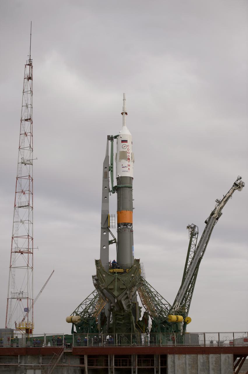 The Soyuz TMA-12M spacecraft is seen after being erected on the launch pad on Sunday, March 23, 2014, at the Baikonur Cosmodrome in Kazakhstan.  Launch of the Soyuz rocket is scheduled for March 26 and will send Expedition 39 Soyuz Commander Alexander Skvortsov of the Russian Federal Space Agency, Roscosmos, Flight Engineer Steven Swanson of NASA, and Flight Engineer Oleg Artemyev of Roscosmos on a six-month mission aboard the International Space Station.  Photo Credit: (NASA/Joel Kowsky)