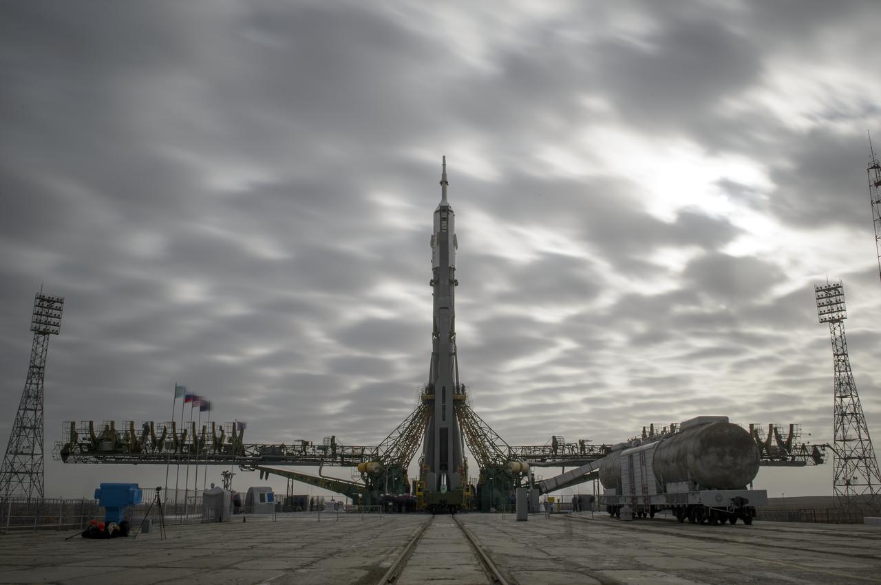 The Soyuz TMA-12M spacecraft is seen after being erected on the launch pad on Sunday, March 23, 2014, at the Baikonur Cosmodrome in Kazakhstan.  Launch of the Soyuz rocket is scheduled for March 26 and will send Expedition 39 Soyuz Commander Alexander Skvortsov of the Russian Federal Space Agency, Roscosmos, Flight Engineer Steven Swanson of NASA, and Flight Engineer Oleg Artemyev of Roscosmos on a six-month mission aboard the International Space Station.  Photo Credit: (NASA/Bill Ingalls)