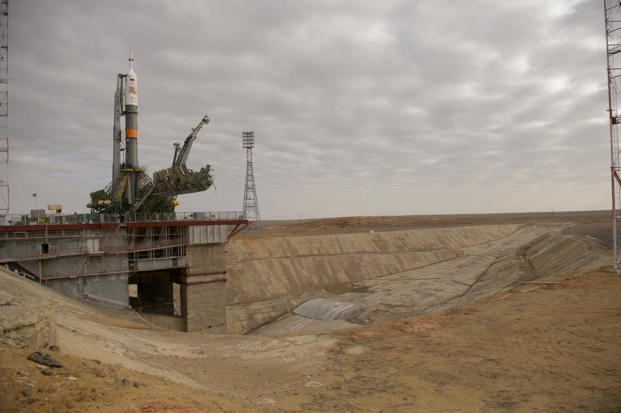 The Soyuz TMA-12M spacecraft is seen after being erected on the launch pad on Sunday, March 23, 2014, at the Baikonur Cosmodrome in Kazakhstan.  Launch of the Soyuz rocket is scheduled for March 26 and will send Expedition 39 Soyuz Commander Alexander Skvortsov of the Russian Federal Space Agency, Roscosmos, Flight Engineer Steven Swanson of NASA, and Flight Engineer Oleg Artemyev of Roscosmos on a six-month mission aboard the International Space Station.  Photo Credit: (NASA/Joel Kowsky)