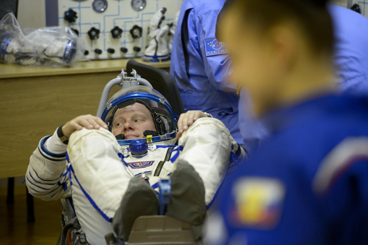 Expedition 39 Flight Engineer Oleg Artemyev of the Russian Federal Space Agency, Roscosmos, has his Russian Sokol suit pressure checked in preparation for his launch onboard the Soyuz TMA-12M spacecraft on Tuesday, March 25, 2014 at the Baikonur Cosmodrome in Kazakhstan. The Soyuz spacecraft with Artemyev, Expedition 39 Soyuz Commander Alexander Skvortsov of Roscosmos and Flight Engineer Steve Swanson of NASA is scheduled to launch at 3:17 a.m. Kazakhstan time on Wednesday, March 26. Photo Credit: (NASA/Joel Kowsky)
