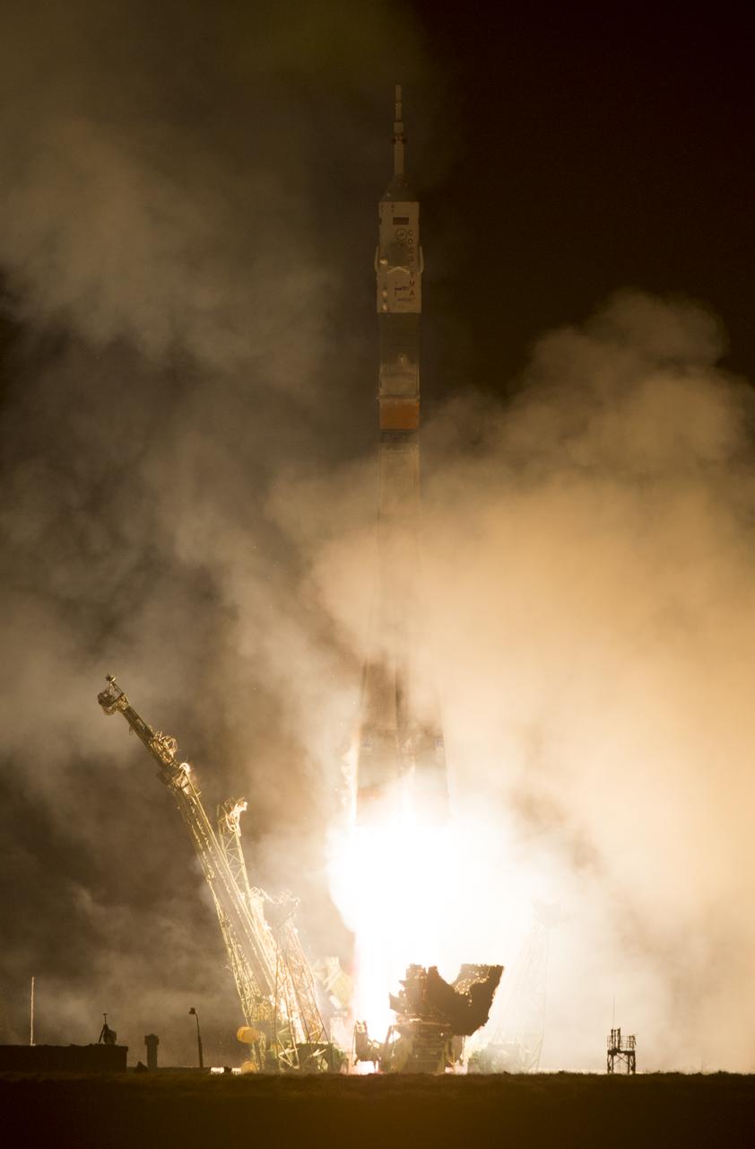 The Soyuz TMA-12M rocket launches from Baikonur Cosmodrome in Kazakhstan on  Wednesday, March 26, 2014 carrying Expedition 39 Soyuz Commander Alexander Skvortsov of the Russian Federal Space Agency, Roscosmos, Flight Engineer Steven Swanson of NASA, and Flight Engineer Oleg Artemyev of Roscosmos to the International Space Station. Photo Credit: (NASA/Joel Kowsky)