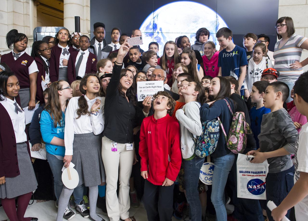 NASA Administrator Charles Bolden poses for a quick selfie with students who attended the NASA sponsored Earth Day event April 22, 2014 at Union Station in Washington, DC. NASA announced the "Global Selfie" event as part of its "Earth Right Now" campaign, celebrating the launch of five Earth-observing missions in 2014. All selfies posted to social media with the hashtag "GlobalSelfie" will be included in a mosaic image of Earth. Photo Credit: (NASA/Aubrey Gemignani)