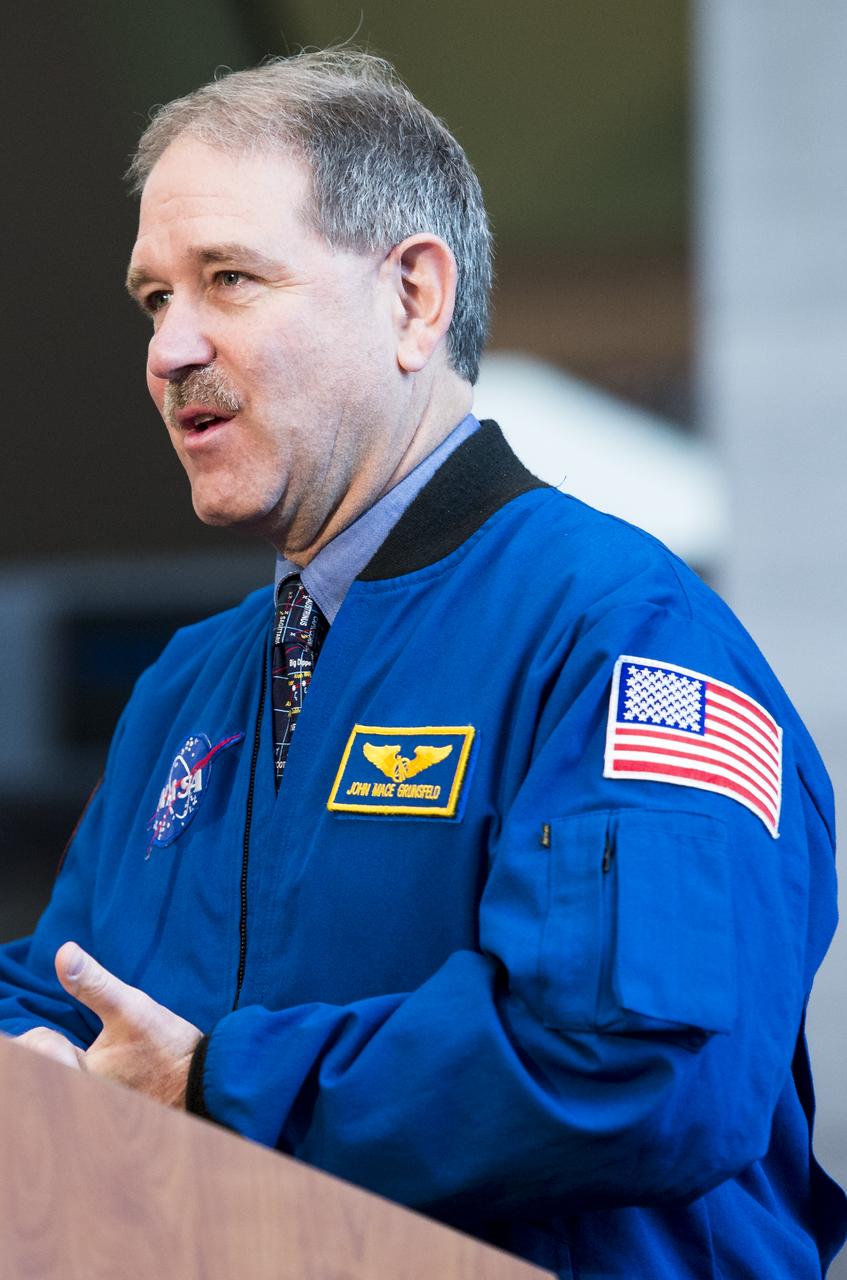 John Grunsfeld, NASA Associate Administrator for the Science Mission Directorate, speaks during during an event unveiling a new exhibit featuring Hubble's Corrective Optics Space Telescope Axial Replacement (COSTAR) and the Wide Field and Planetary Camera 2 (WFPC2)  on Wednesday, April 23, 2014 at the Smithsonian National Air and Space Museum in Washington, DC. Grunsfeld flew on three of space shuttle servicing missions to Hubble, including the fifth and final mission in 2009 which returned COSTAR and WFPC2 to Earth.  Photo Credit: (NASA/Joel Kowsky)